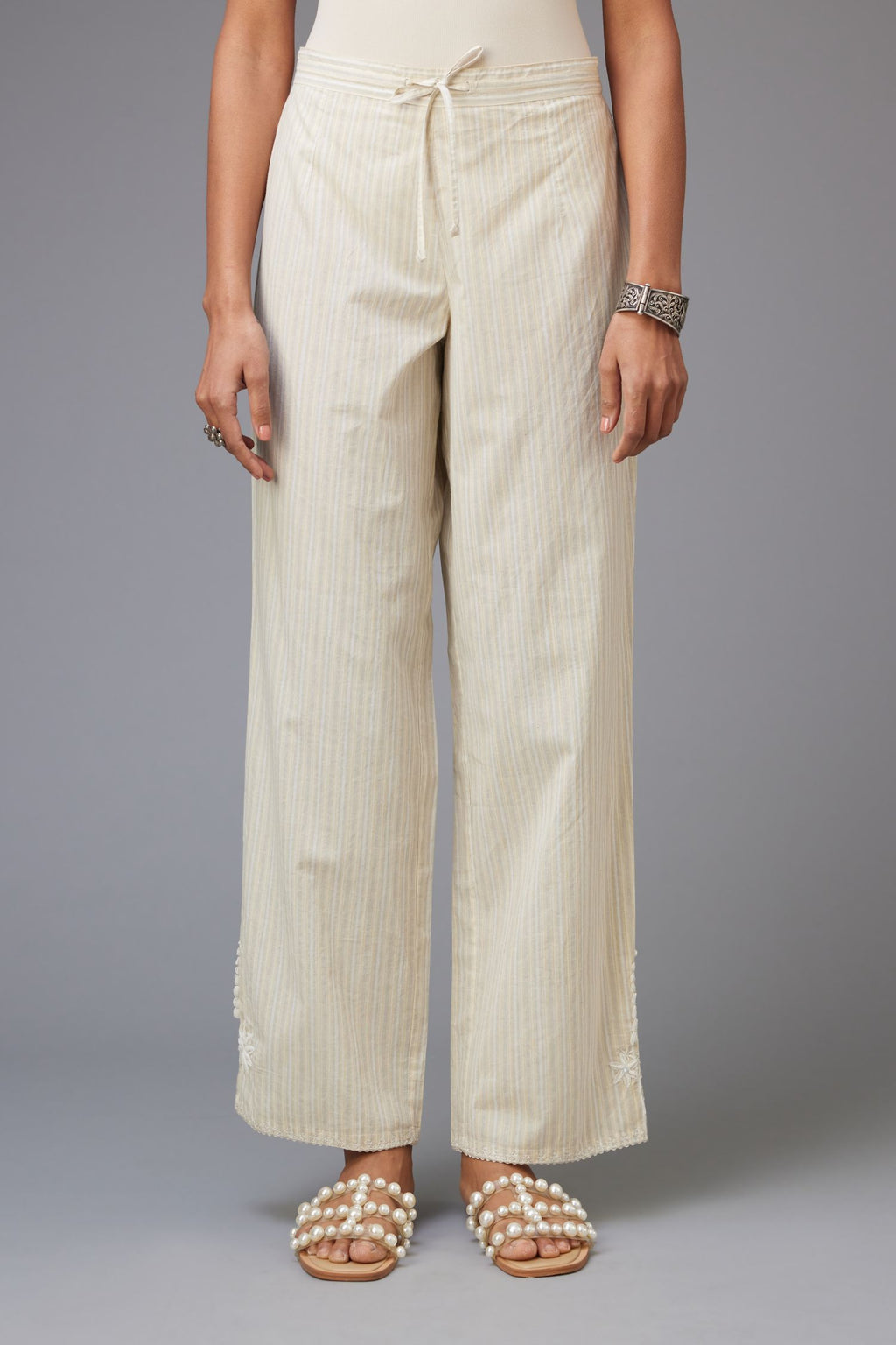 Yellow and grey stripe cotton straight pants with a chiffon embroidered boota at the hem.