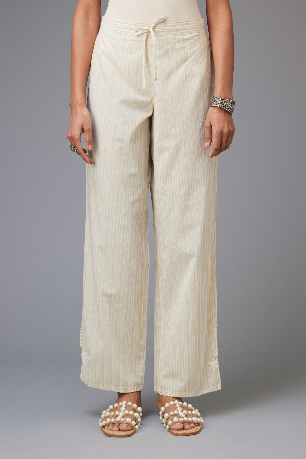 Yellow and grey stripe cotton straight pants with a chiffon embroidered boota at the hem.
