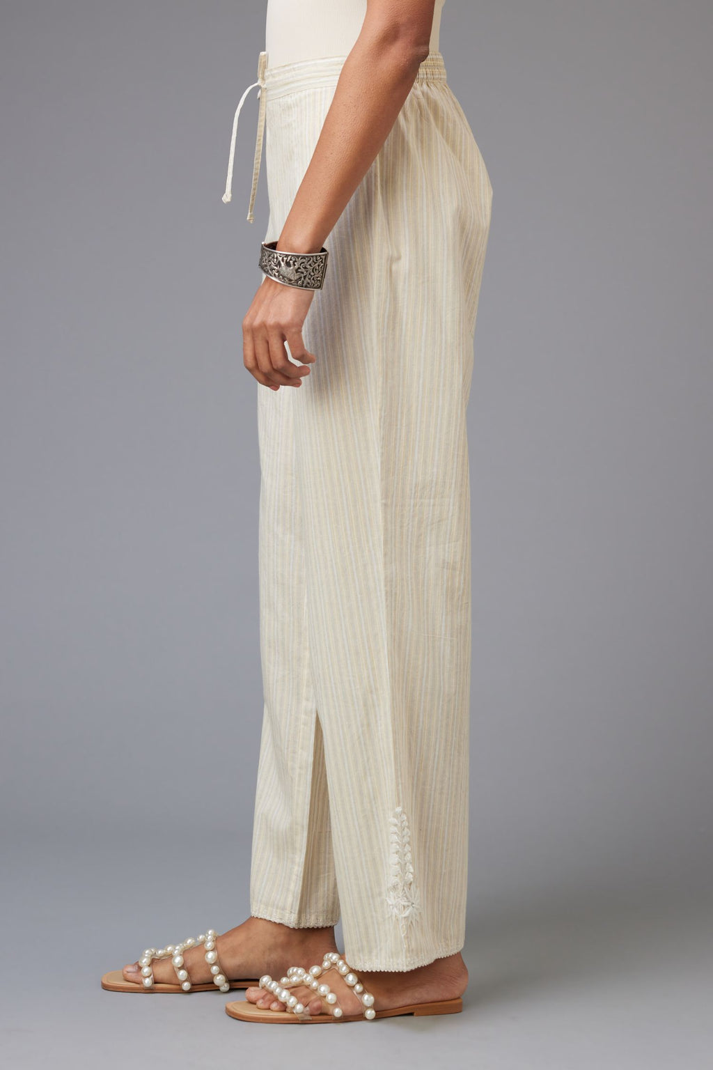 Yellow and grey stripe cotton straight pants with a chiffon embroidered boota at the hem.