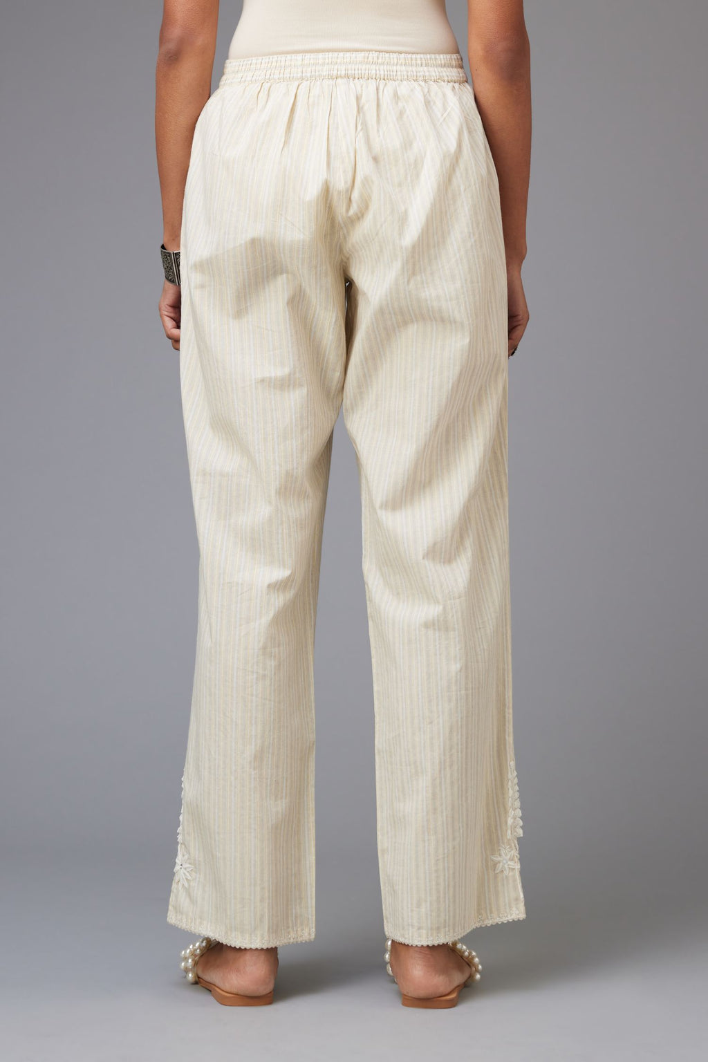 Yellow and grey stripe cotton straight pants with a chiffon embroidered boota at the hem.
