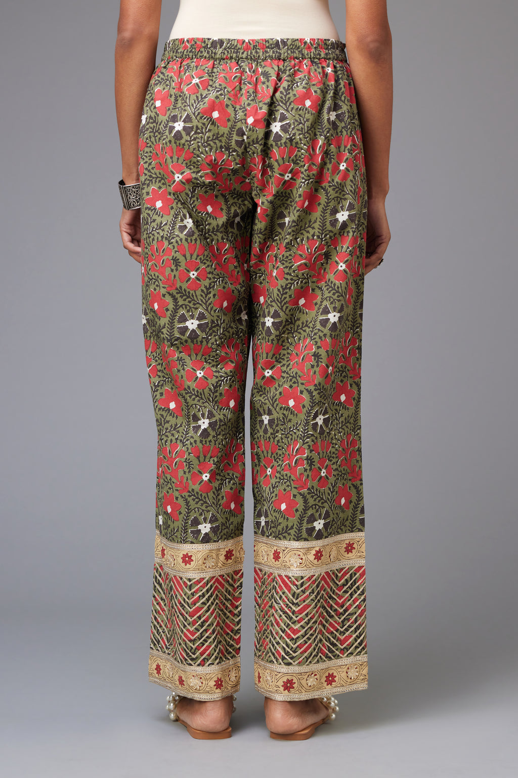 Red and green cotton hand block printed straight pants detailed with gota at the border.