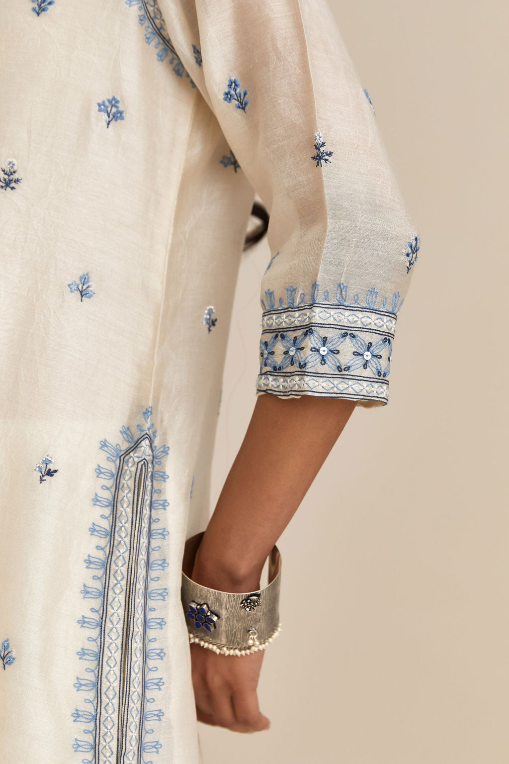 Off-white silk Chanderi kurta set with floral butis.