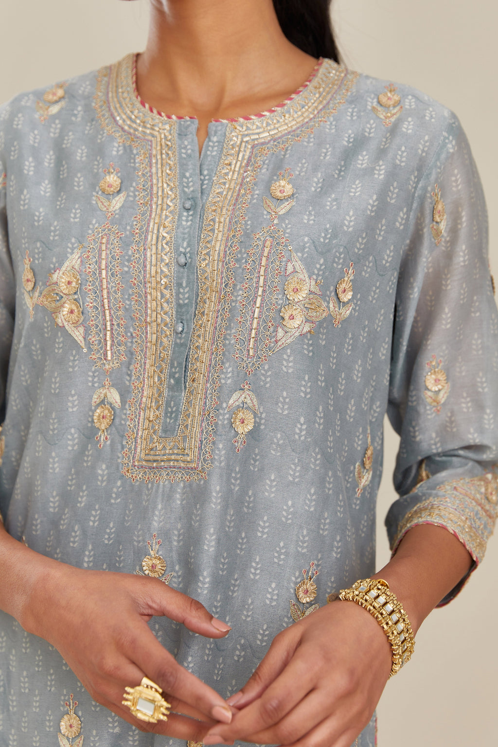 Powder blue silk chanderi straight kurta set with gold gota and zari embroidery.