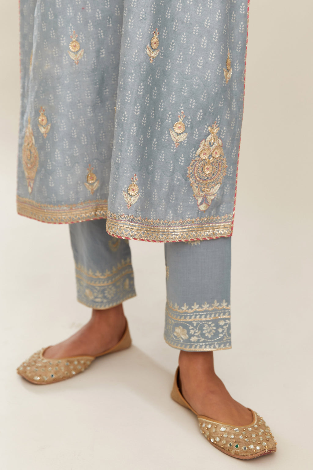 Powder blue silk chanderi straight kurta set with gold gota and zari embroidery.