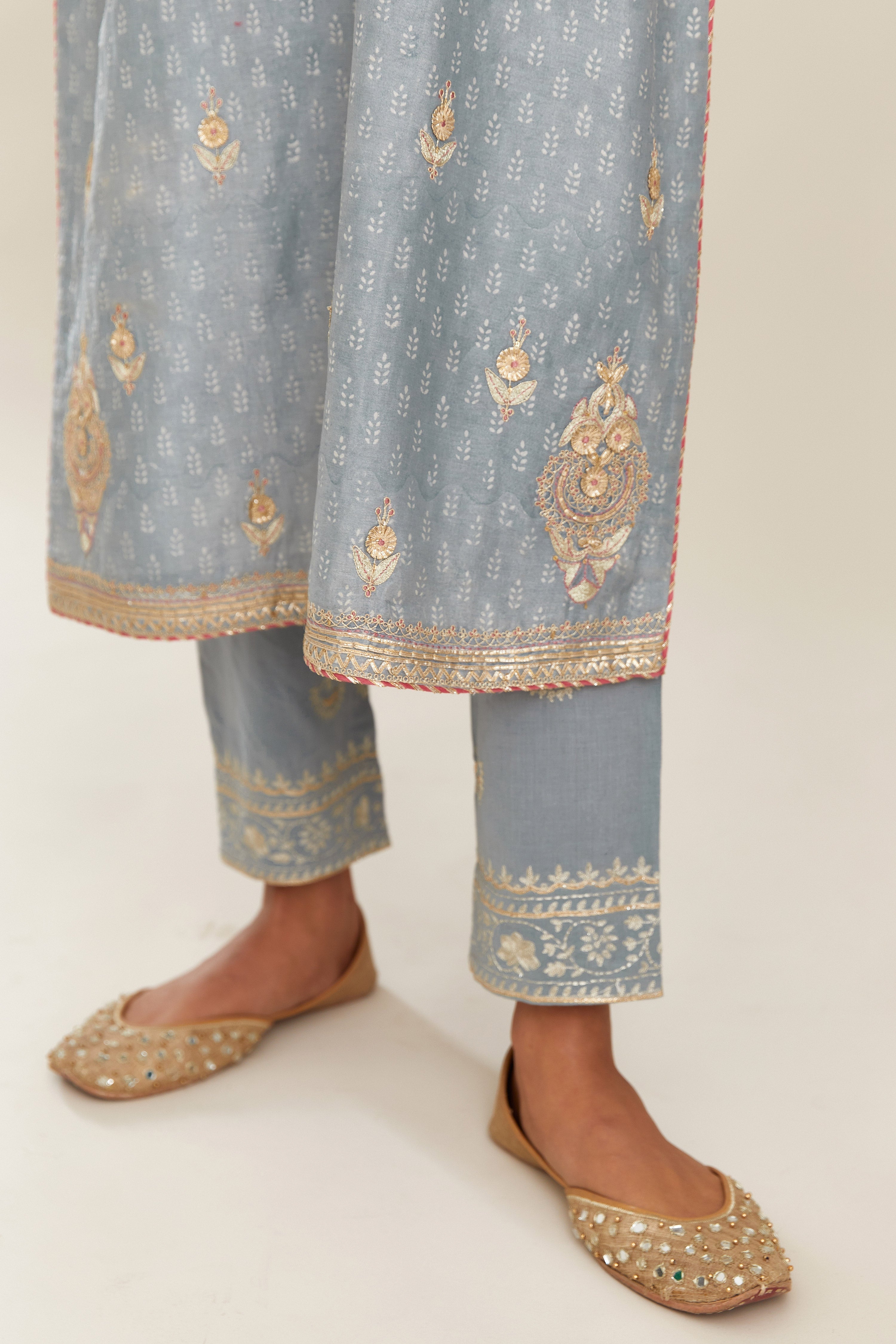 Powder blue silk chanderi straight kurta set with gold gota and zari embroidery.