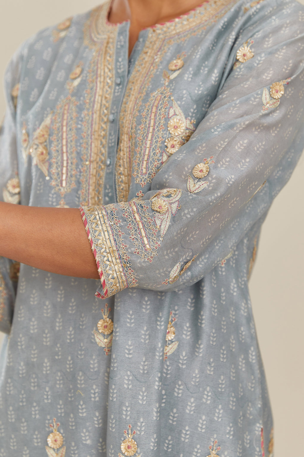 Powder blue silk chanderi straight kurta set with gold gota and zari embroidery.