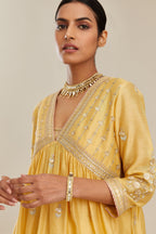 Yellow silk chanderi kurta set with heavy gold gota and zari embroidery and emroidered cotton slip inside.
