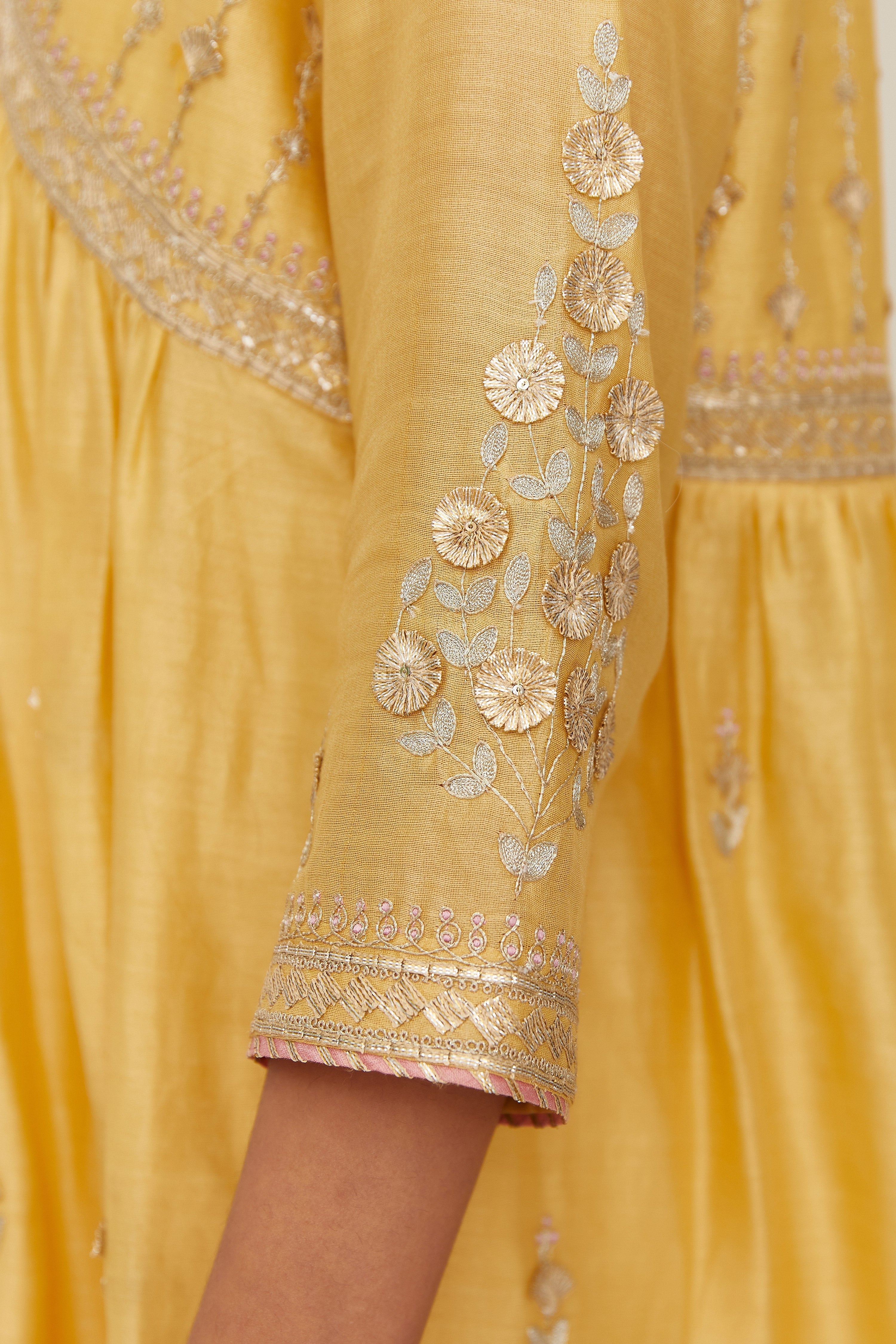Yellow silk chanderi kurta set with heavy gold gota and zari embroidery and emroidered cotton slip inside.