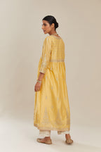 Yellow silk chanderi kurta set with heavy gold gota and zari embroidery and emroidered cotton slip inside.