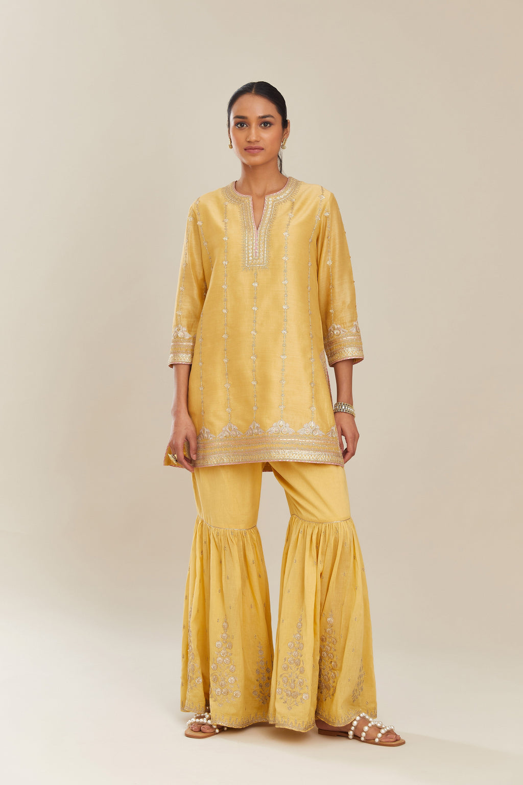 Yellow silk chanderi short kurta set with all over heavy gold gota and zari embroidery