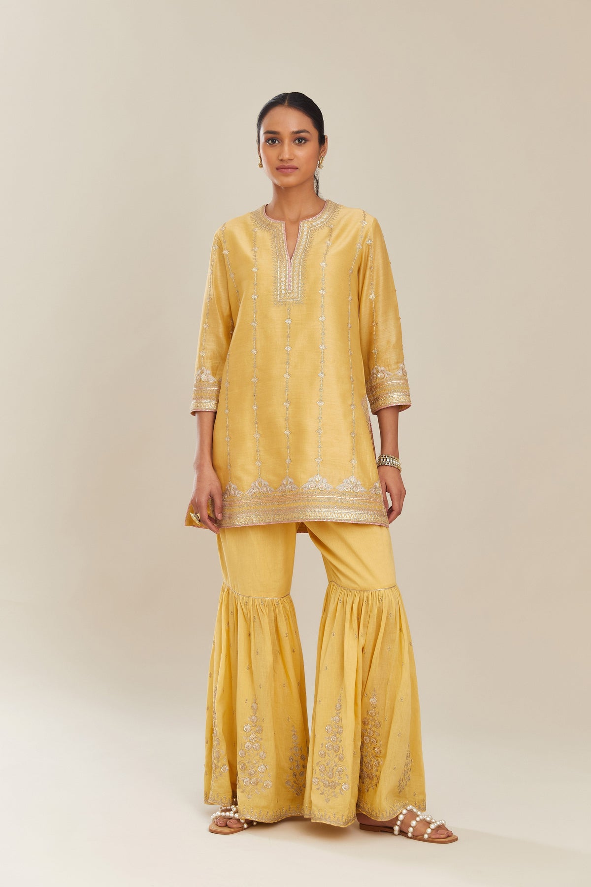 Yellow silk chanderi short kurta set with all over heavy gold gota and zari embroidery
