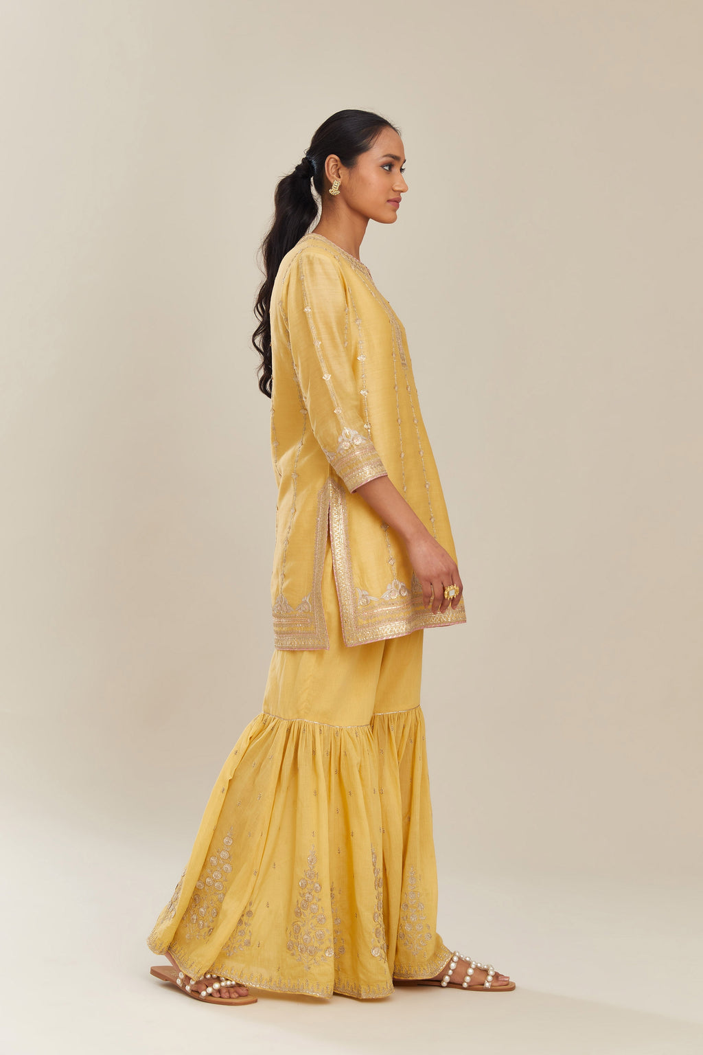 Yellow silk chanderi short kurta set with all over heavy gold gota and zari embroidery