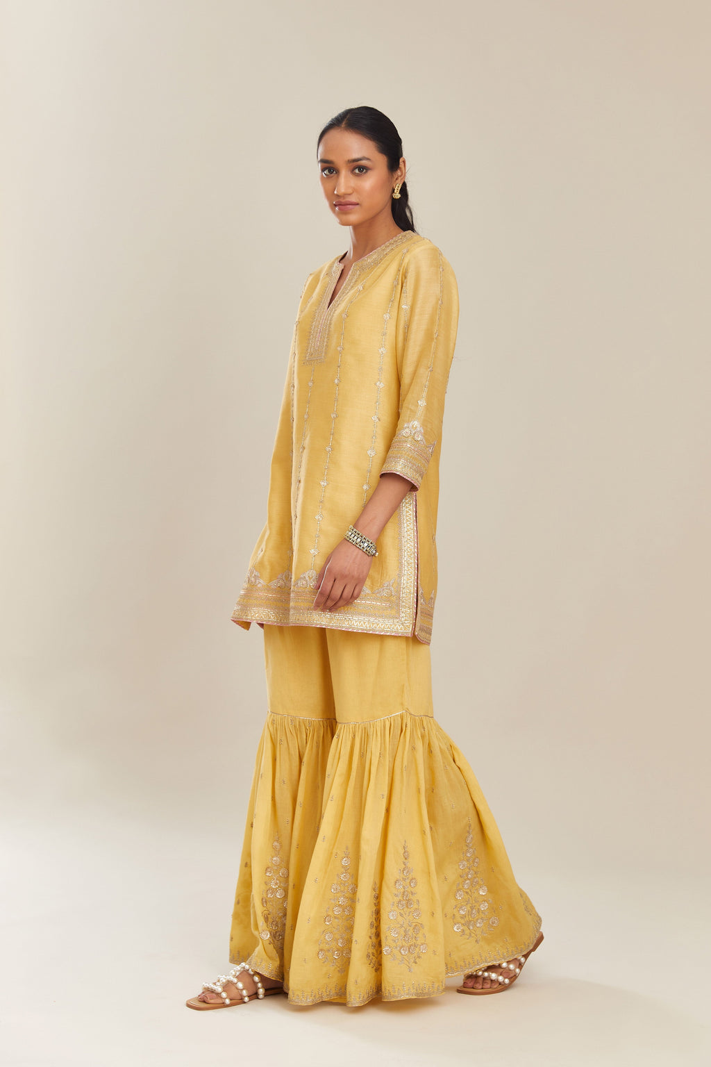 Yellow silk chanderi short kurta set with all over heavy gold gota and zari embroidery