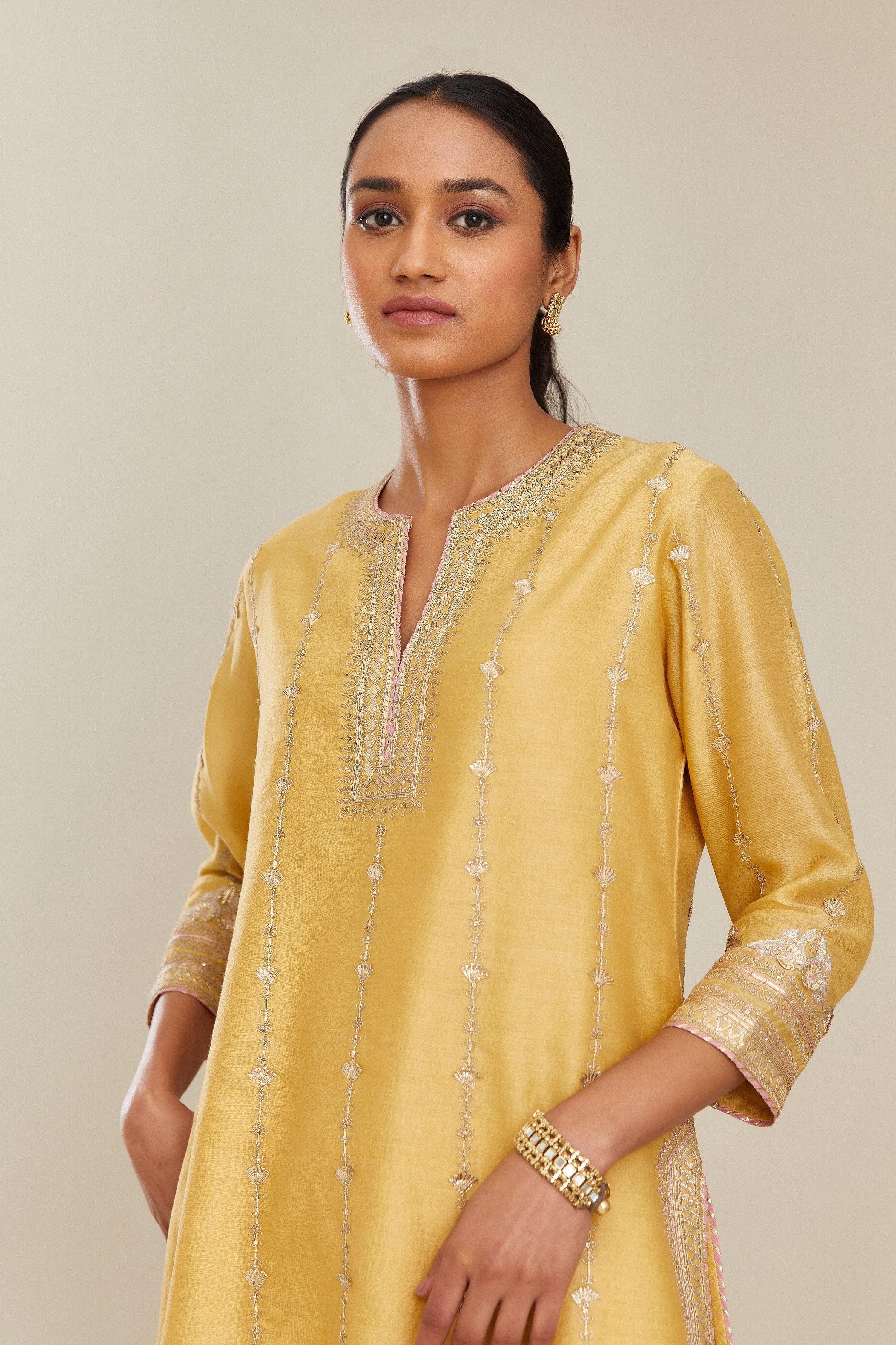 Yellow silk chanderi short kurta set with all over heavy gold gota and zari embroidery