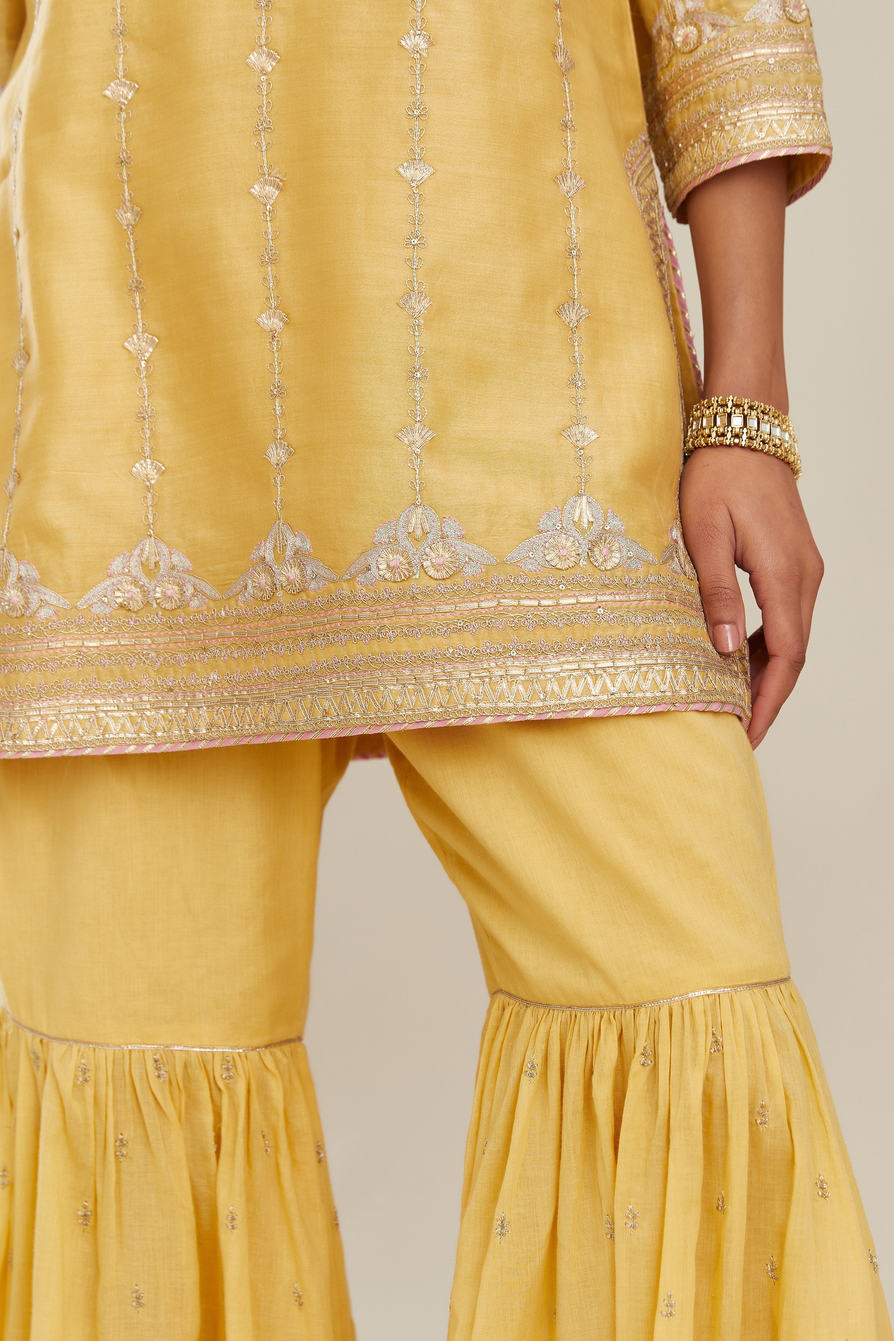Yellow silk chanderi short kurta set with all over heavy gold gota and zari embroidery