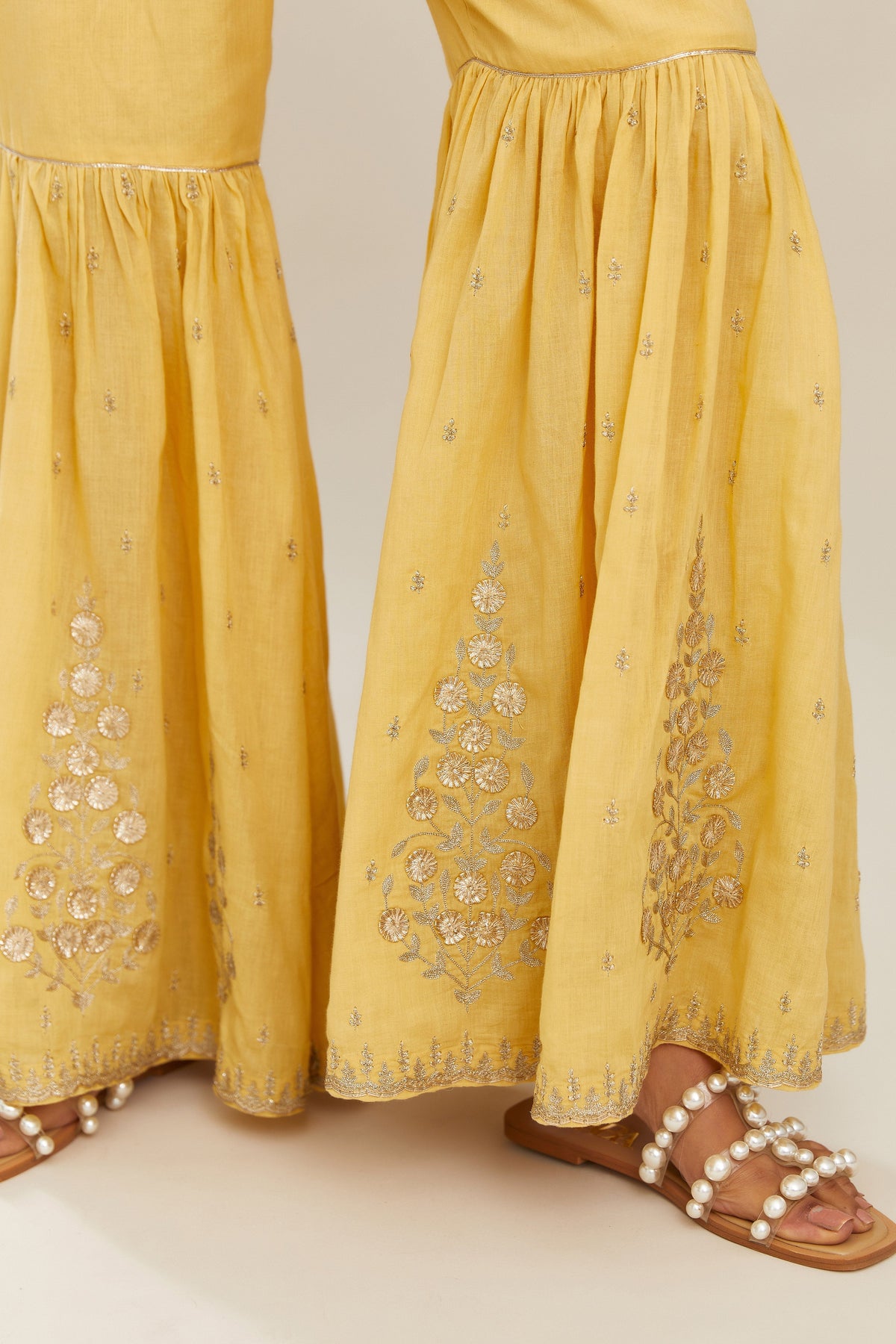 Yellow silk chanderi short kurta set with all over heavy gold gota and zari embroidery
