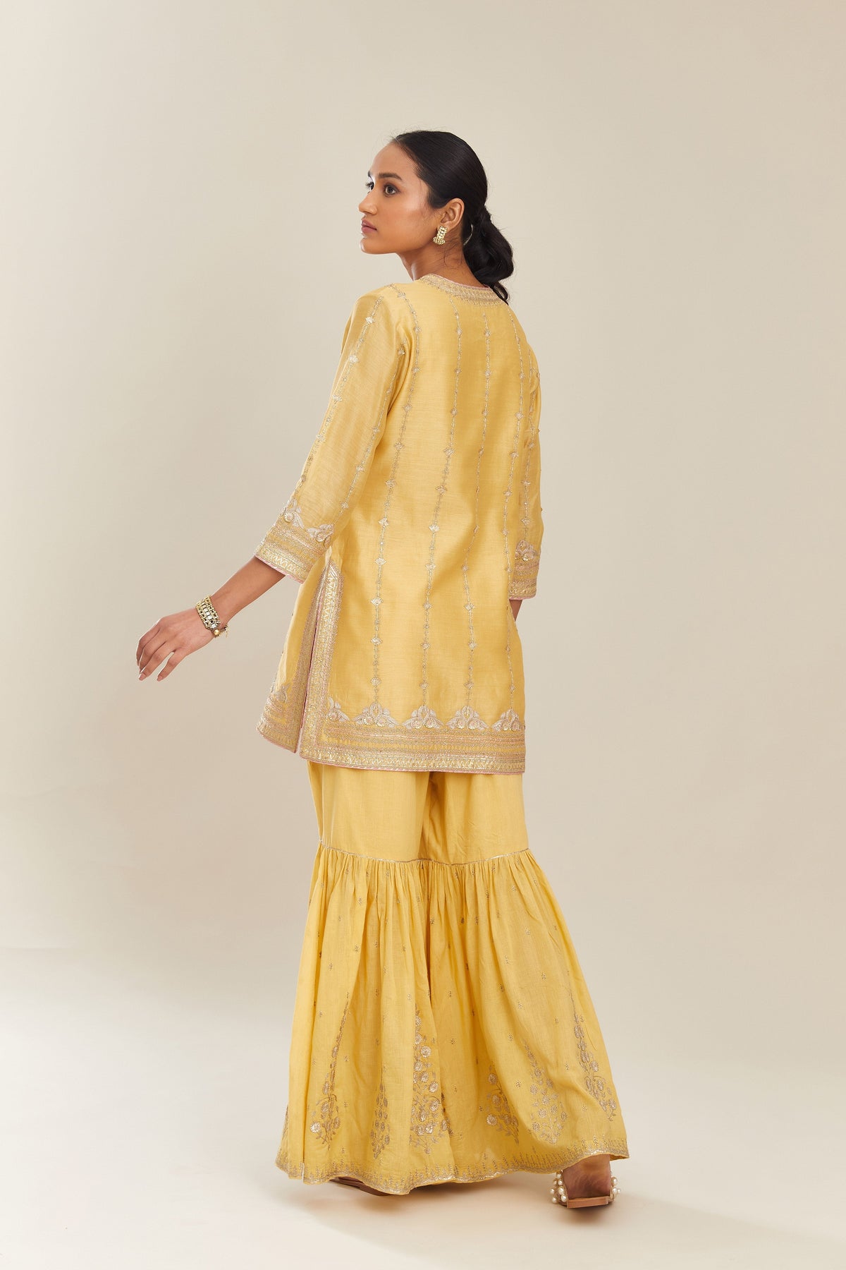 Yellow silk chanderi short kurta set with all over heavy gold gota and zari embroidery