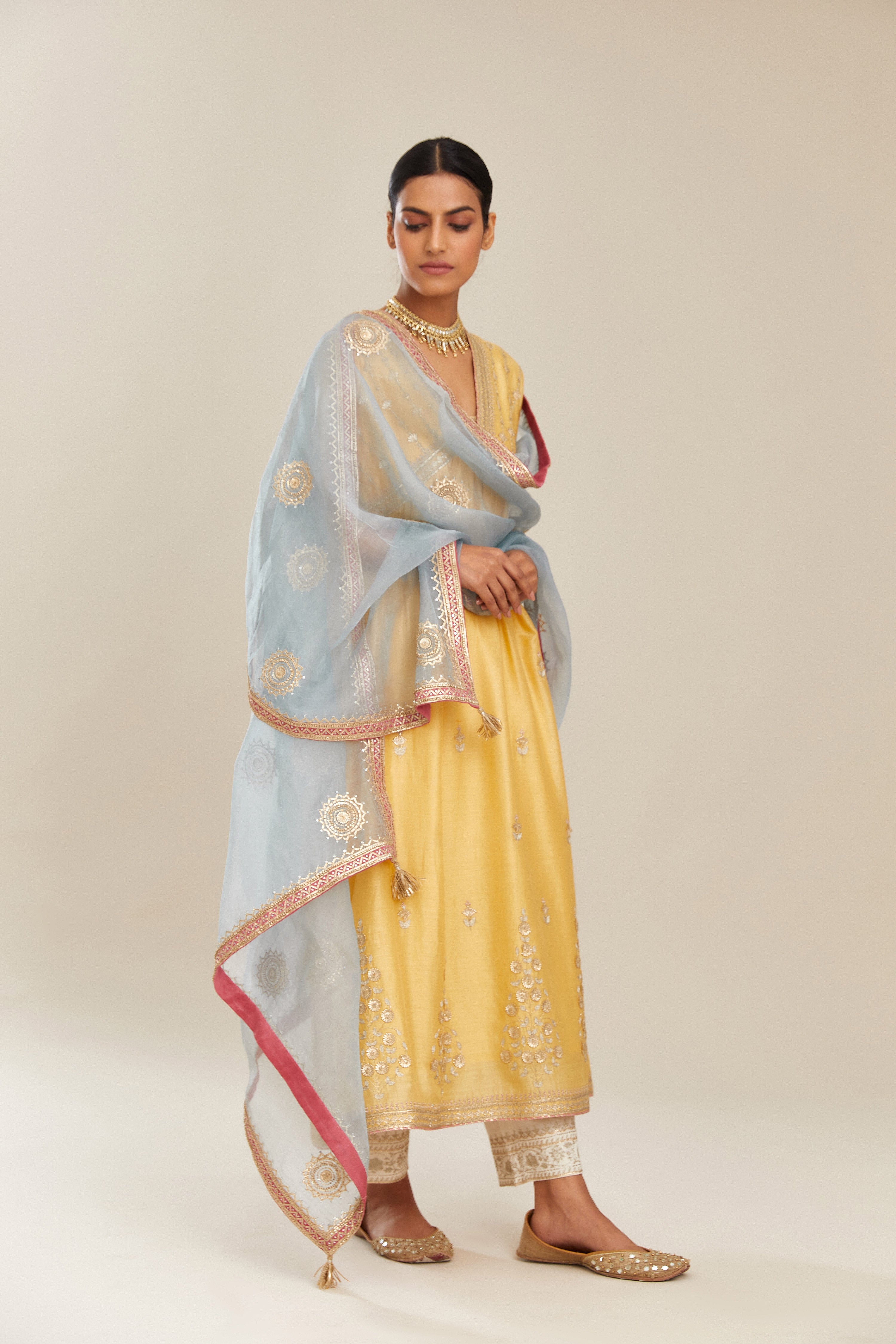 Blue silk organza dupatta with delicate gold gota embroidery and contrast colored border running along all edges.