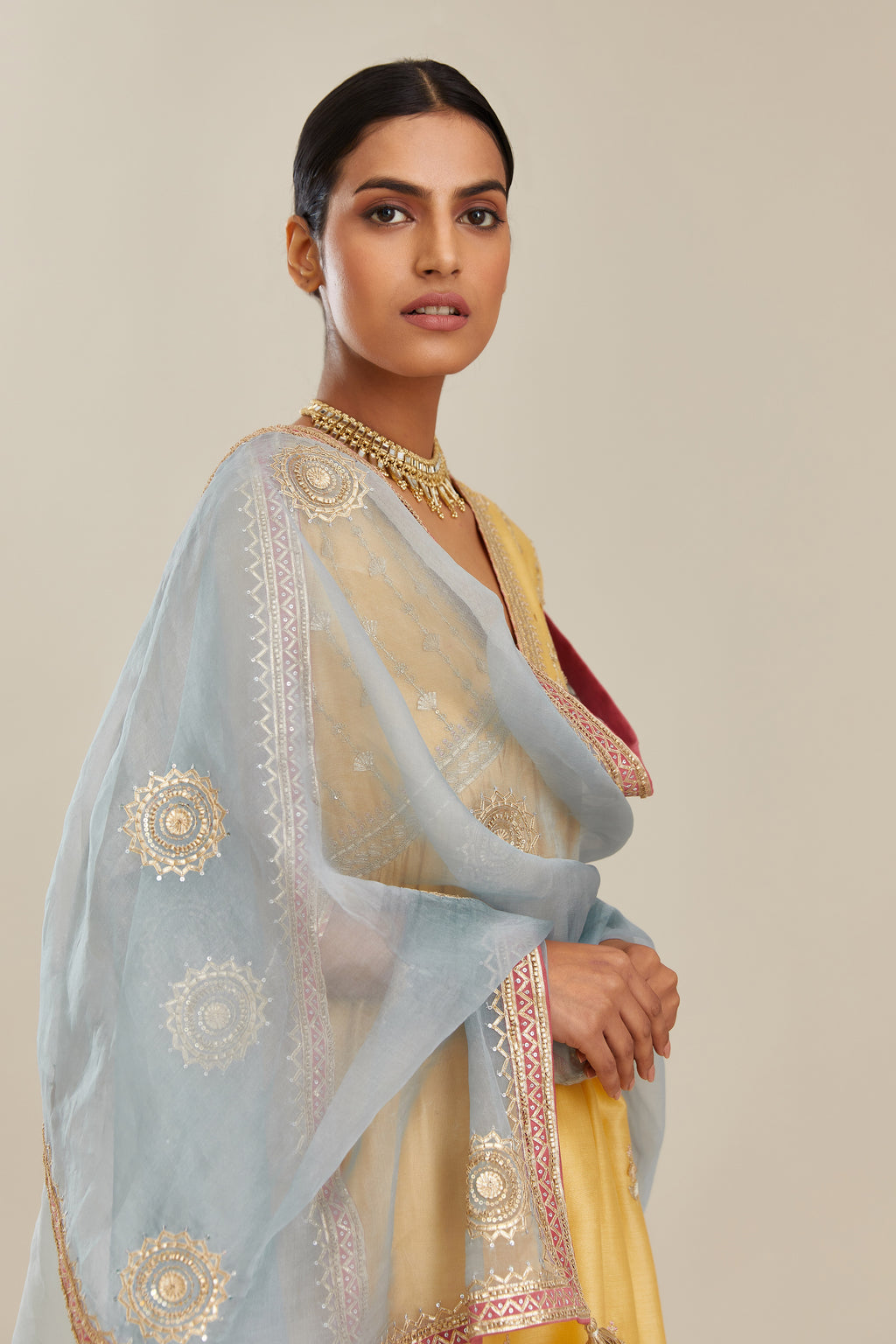 Yellow silk chanderi kurta set with heavy gold gota and zari embroidery and emroidered cotton slip inside.