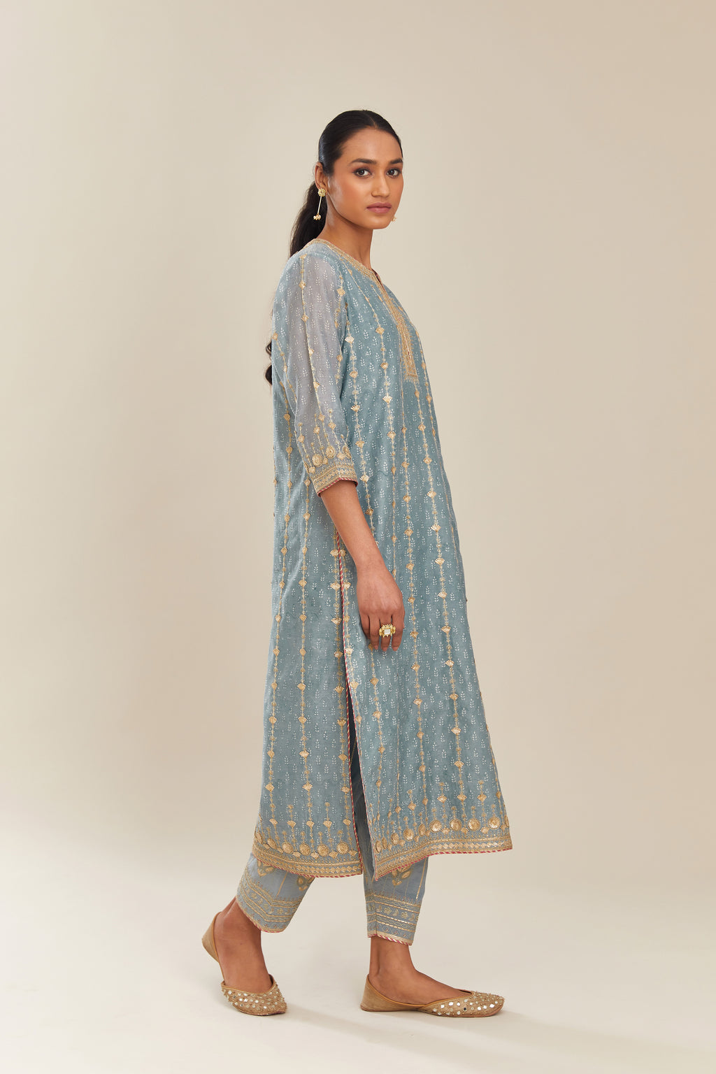 Powder blue hand block printed silk chanderi straight kurta set with all over heavy gold gota and zari embroidery.