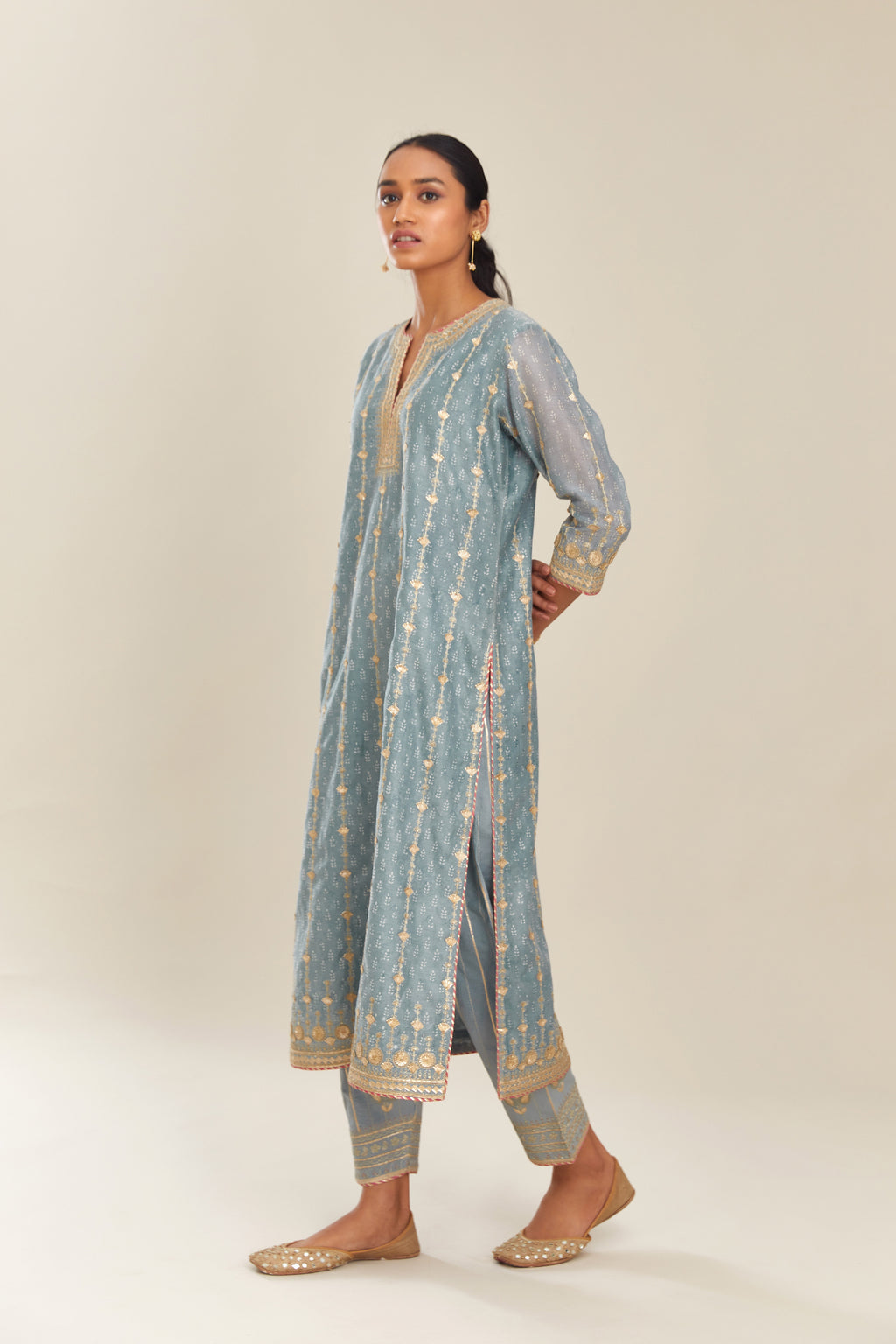 Powder blue hand block printed silk chanderi straight kurta set with all over heavy gold gota and zari embroidery.