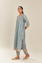 Powder blue hand block printed silk chanderi straight kurta set with all over heavy gold gota and zari embroidery.