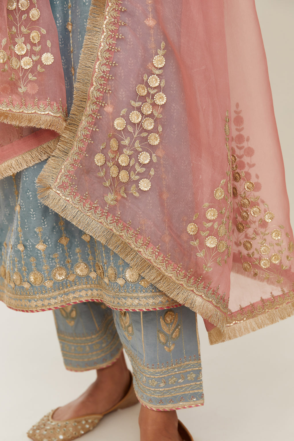 Powder blue hand block printed silk chanderi straight kurta set with all over heavy gold gota and zari embroidery.