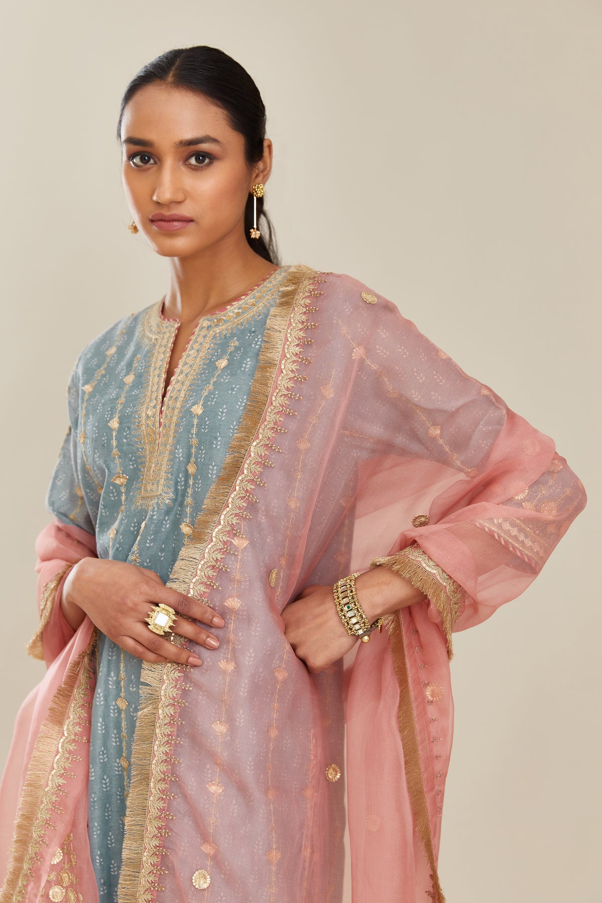 Pink silk organza dupatta with delicate gold zari and gota embroidery border running along all edges.