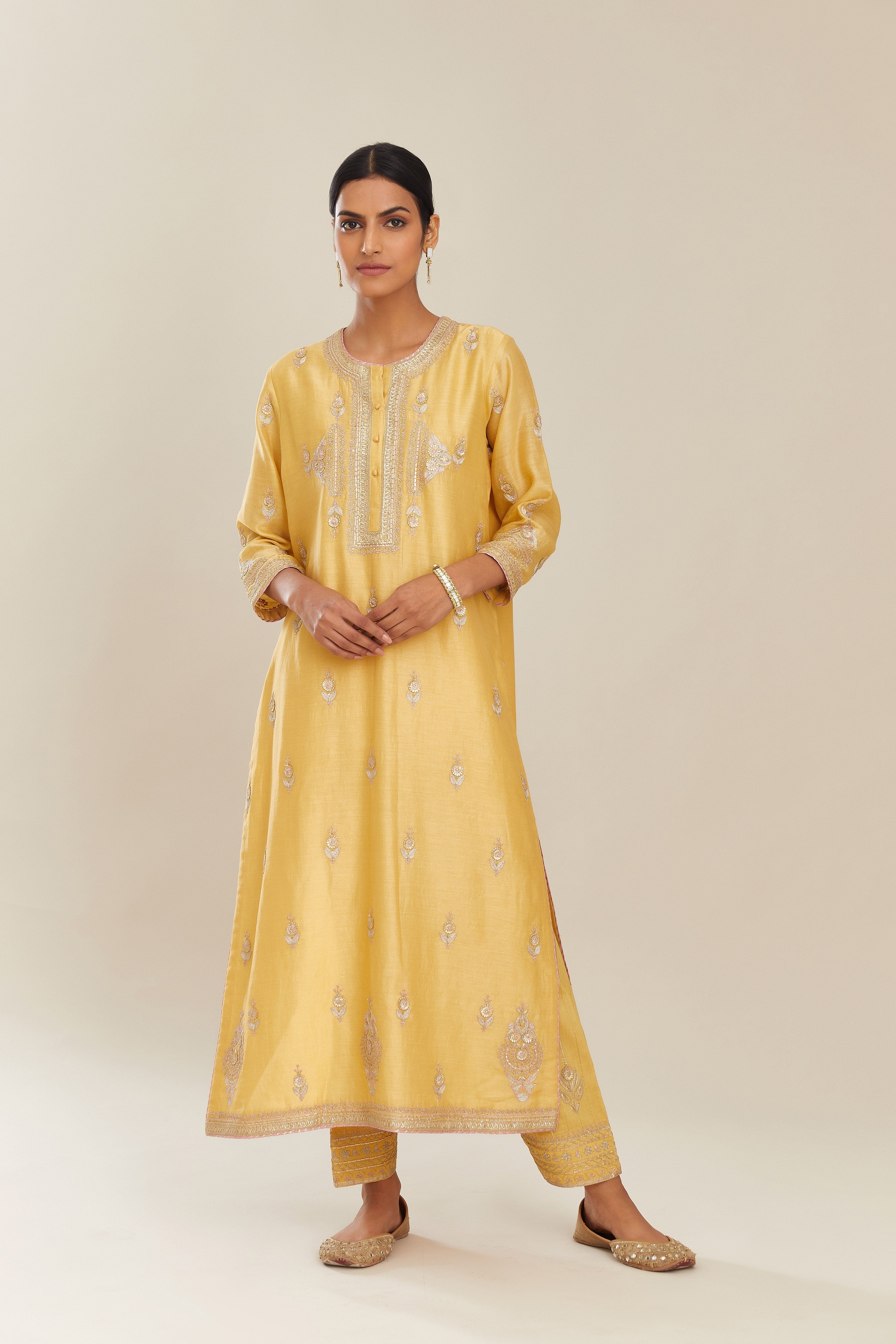 Yellow silk chanderi straight kurta set with gold gota and zari embroidery.