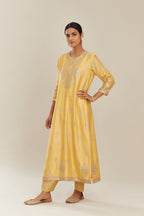 Yellow silk chanderi straight kurta set with gold gota and zari embroidery.