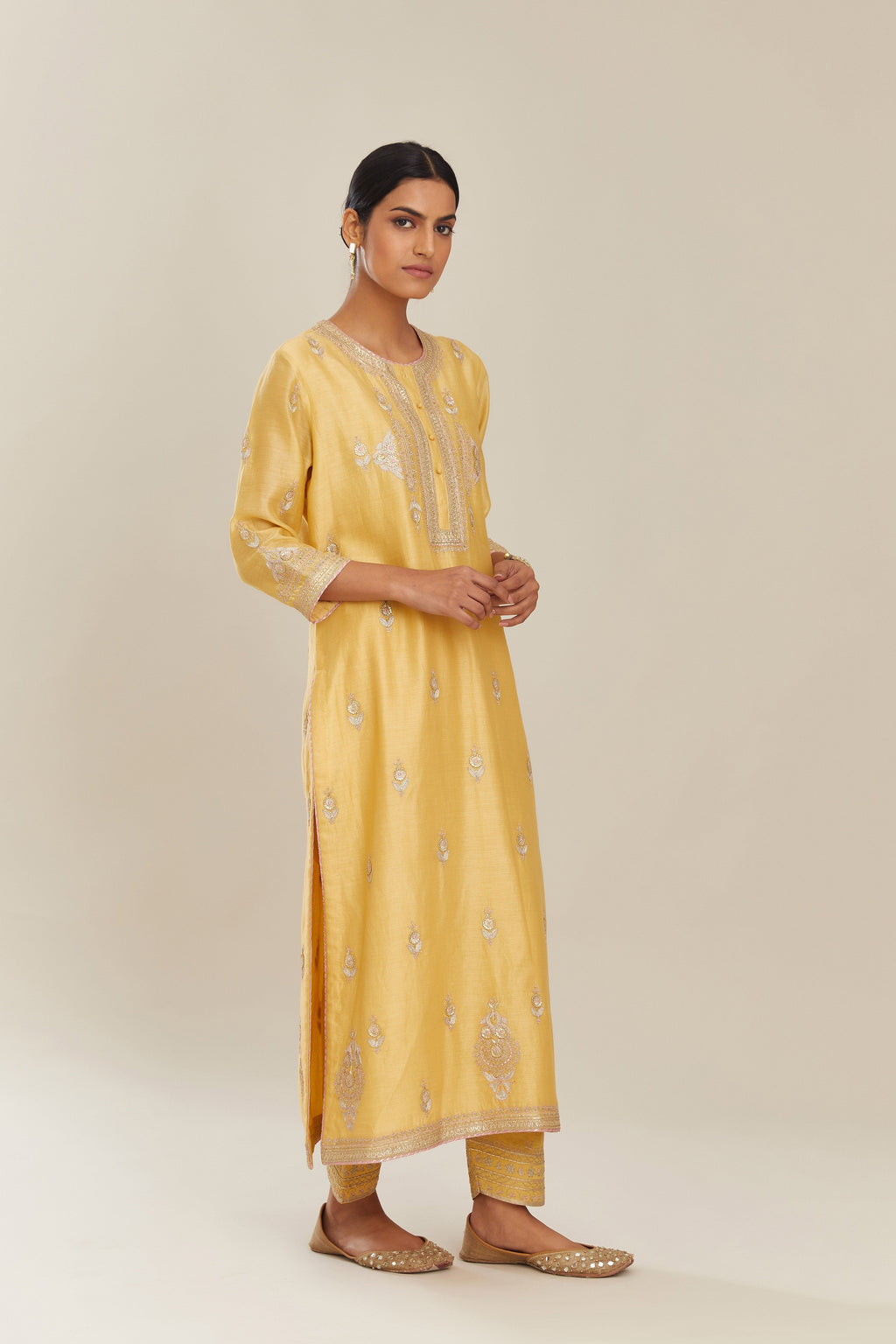 Yellow silk chanderi straight kurta set with gold gota and zari embroidery.