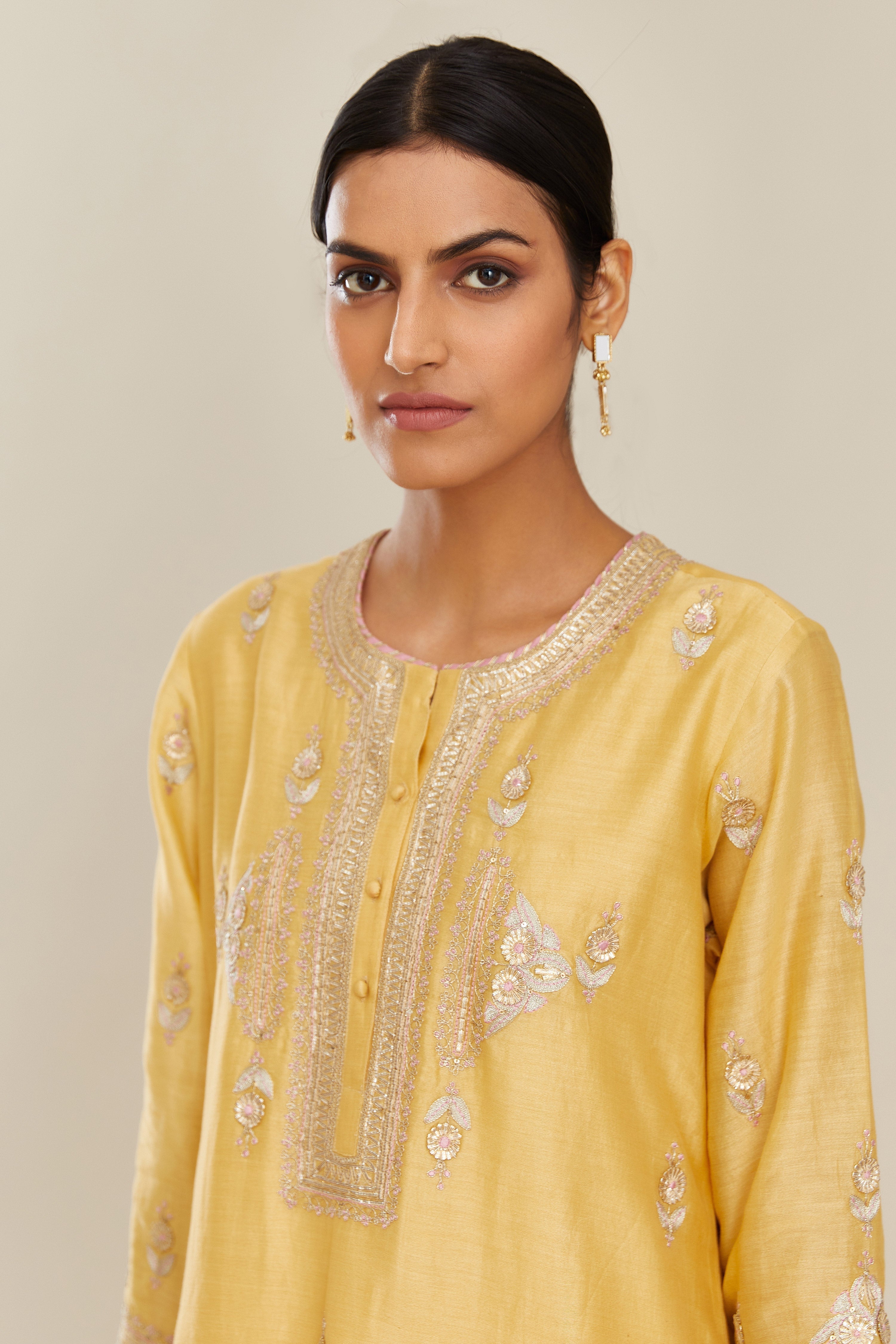 Yellow silk chanderi straight kurta set with gold gota and zari embroidery.