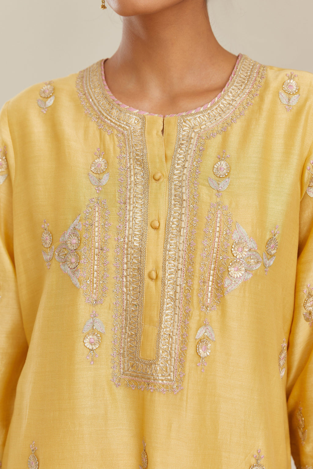 Yellow silk chanderi straight kurta set with gold gota and zari embroidery.
