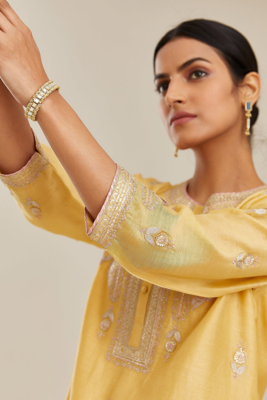 Yellow silk chanderi straight kurta set with gold gota and zari embroidery.