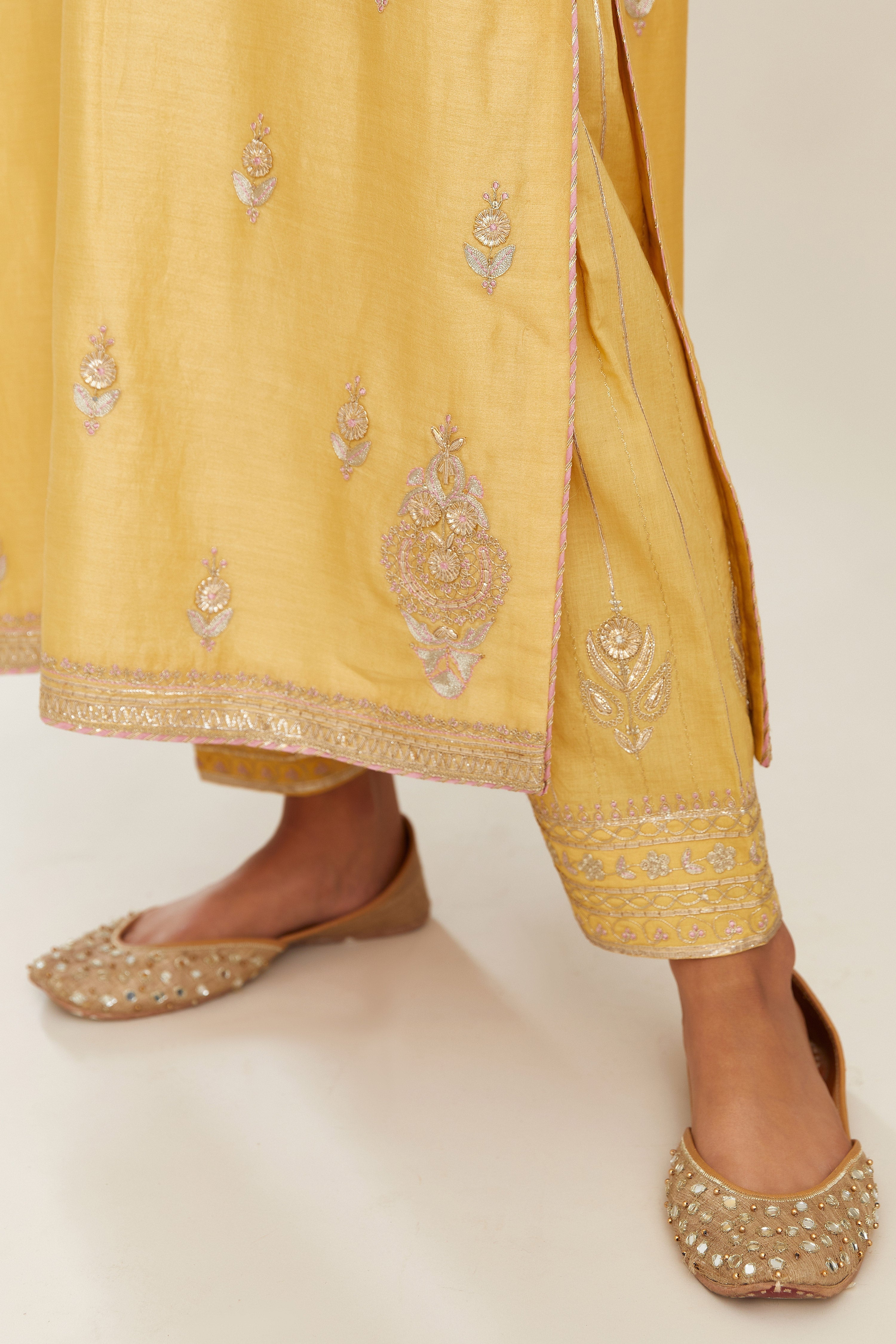 Yellow silk chanderi straight kurta set with gold gota and zari embroidery.