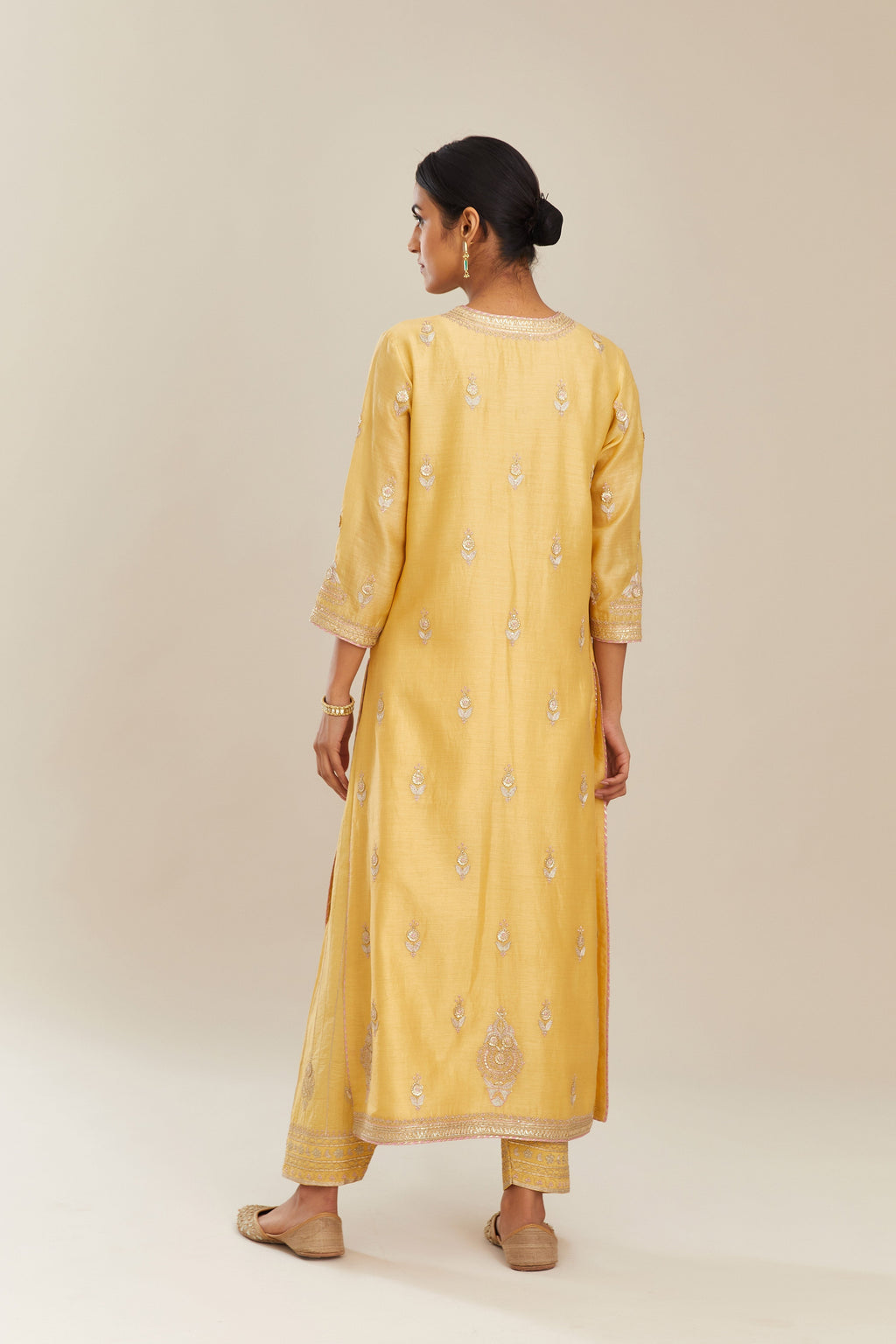 Yellow silk chanderi straight kurta set with gold gota and zari embroidery.