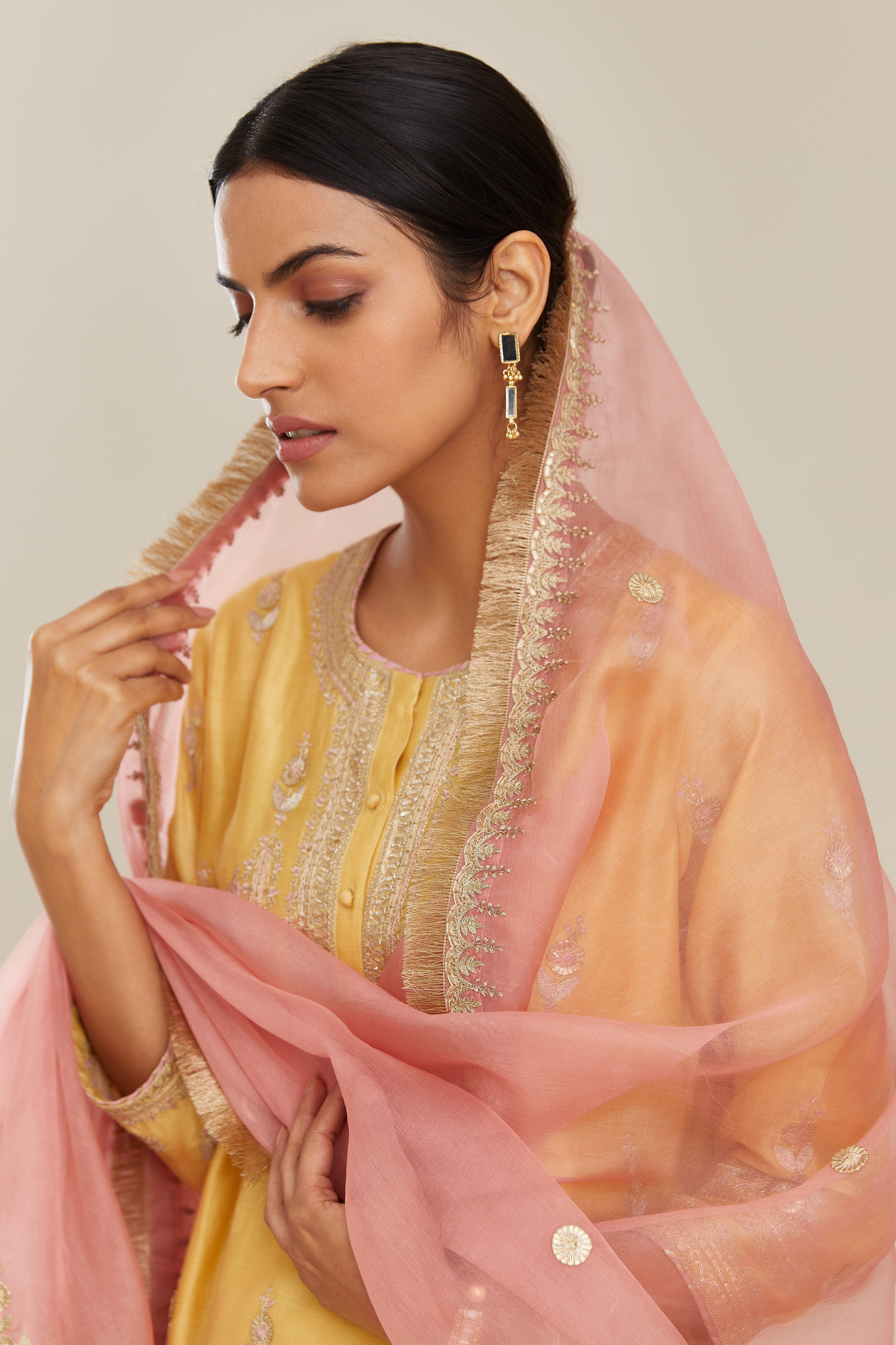 Pink silk organza dupatta with delicate gold zari and gota embroidery border running along all edges.