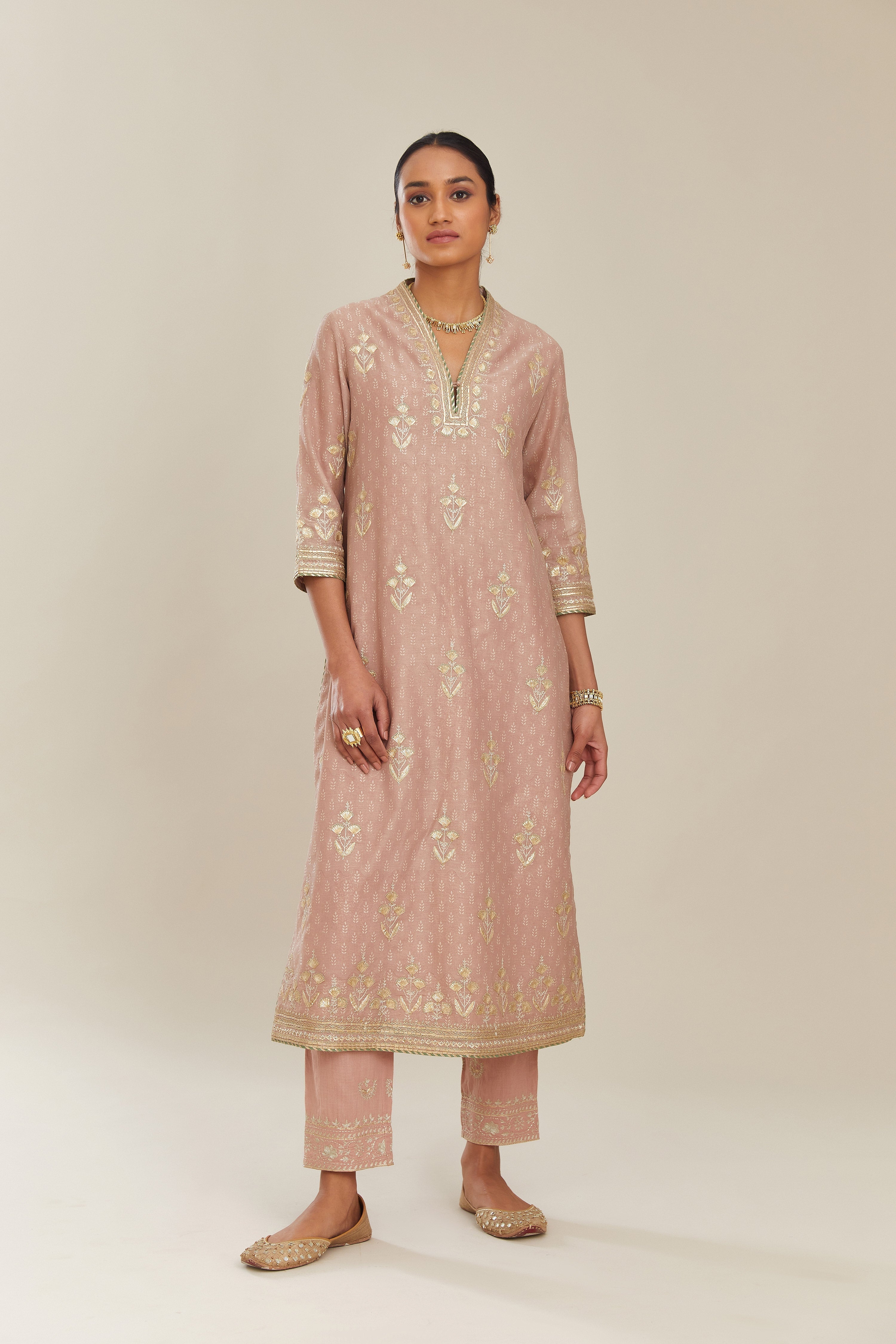 Old rose hand block printed silk chanderi kurta set with gold gota and zari embroidery butas and heavy borders at hem.