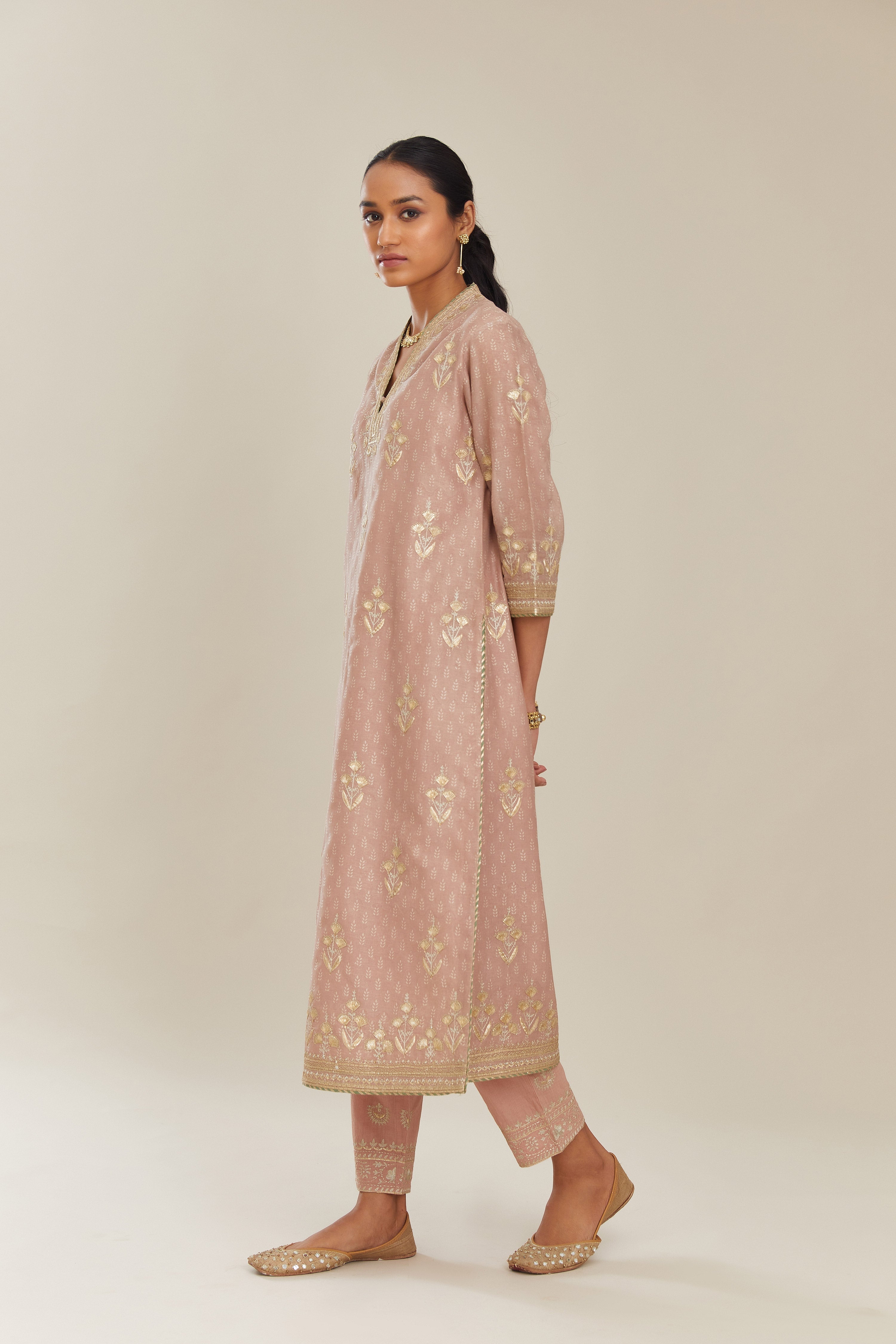 Old rose hand block printed silk chanderi kurta set with gold gota and zari embroidery butas and heavy borders at hem.