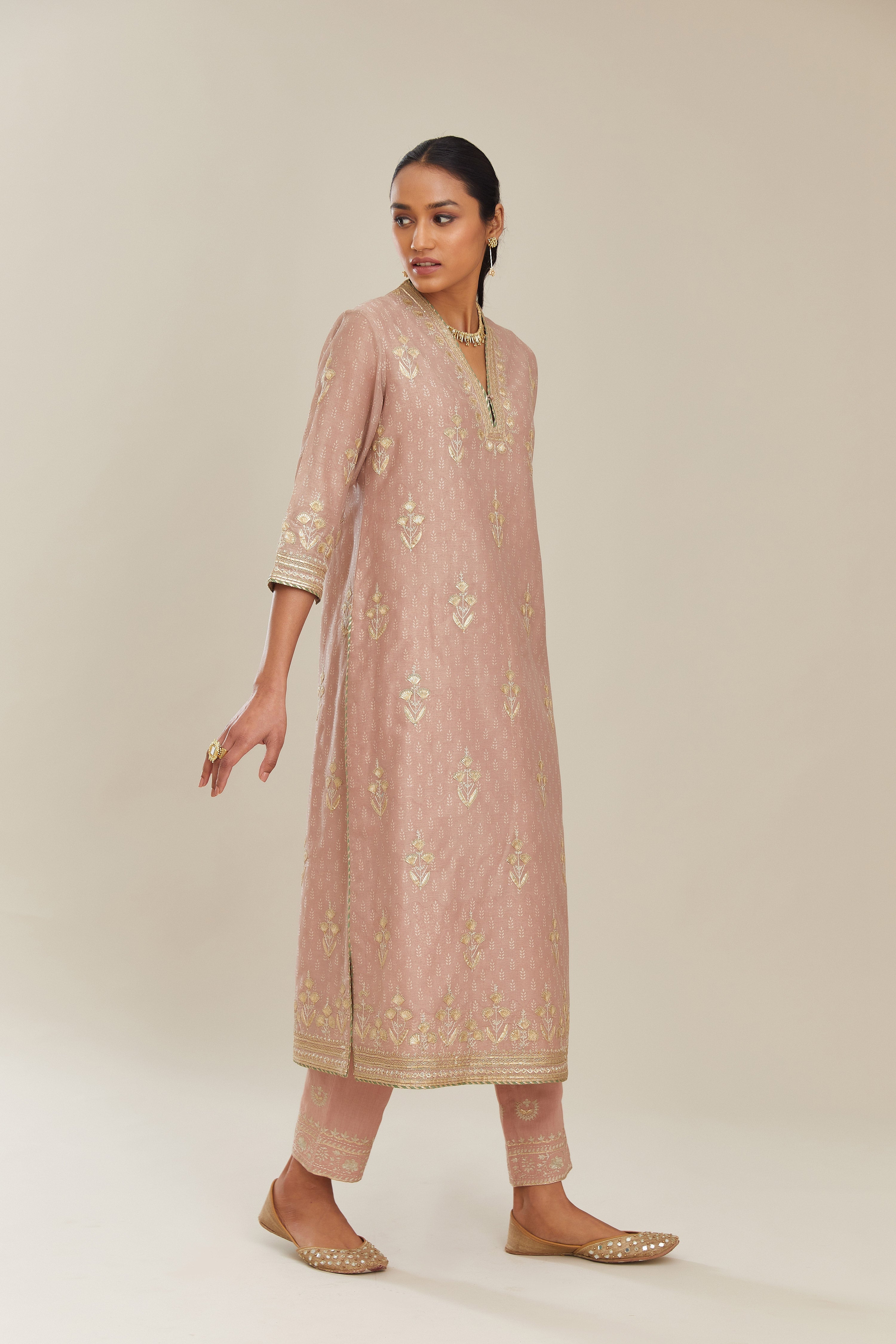 Old rose hand block printed silk chanderi kurta set with gold gota and zari embroidery butas and heavy borders at hem.