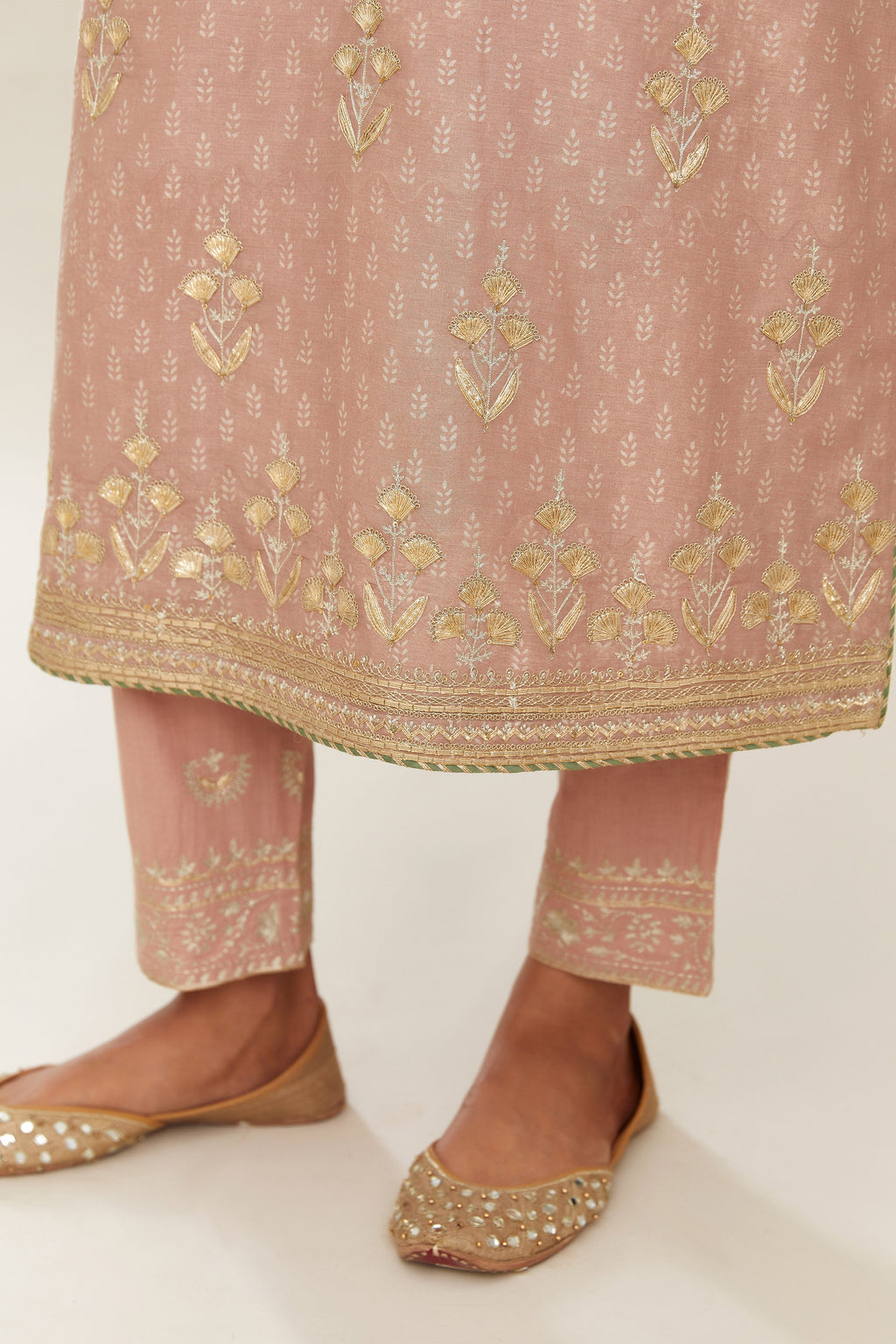 Old rose hand block printed silk chanderi kurta set with gold gota and zari embroidery butas and heavy borders at hem.