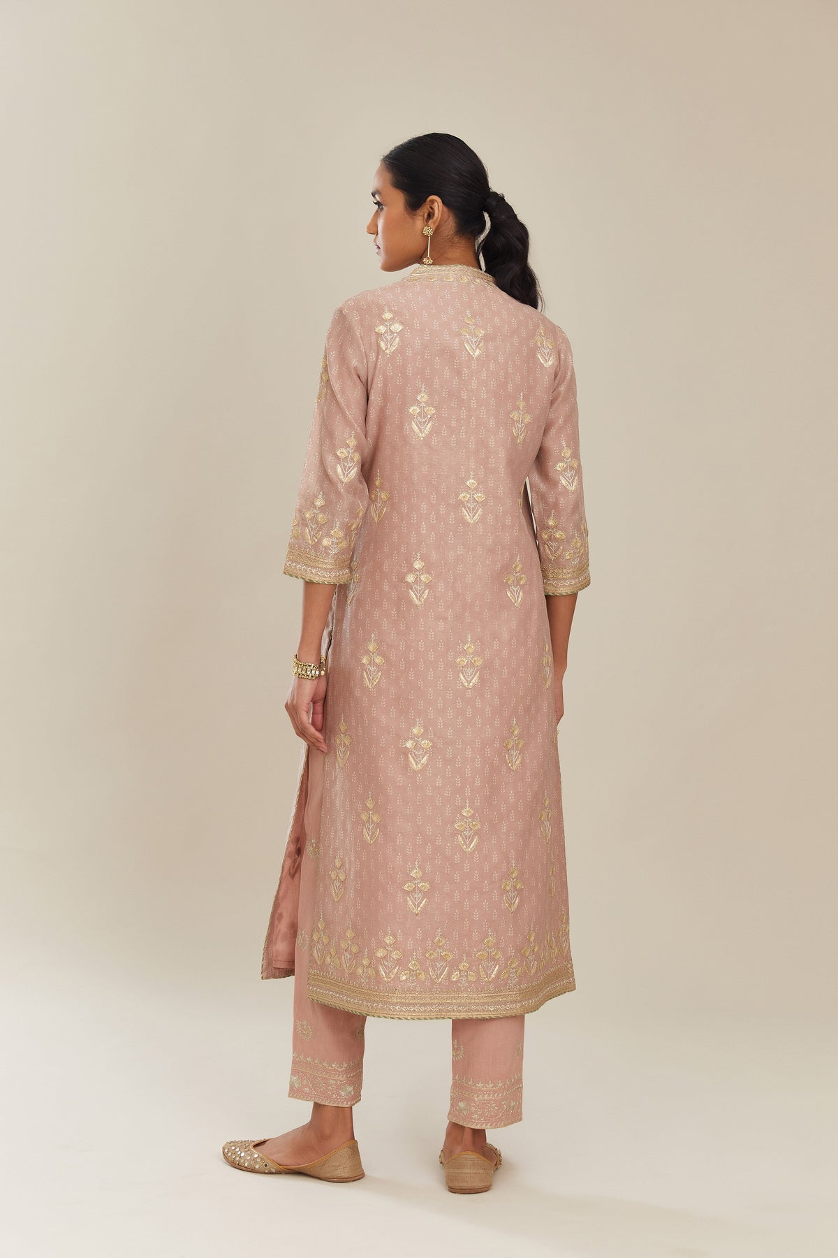 Old rose hand block printed silk chanderi kurta set with gold gota and zari embroidery butas and heavy borders at hem.
