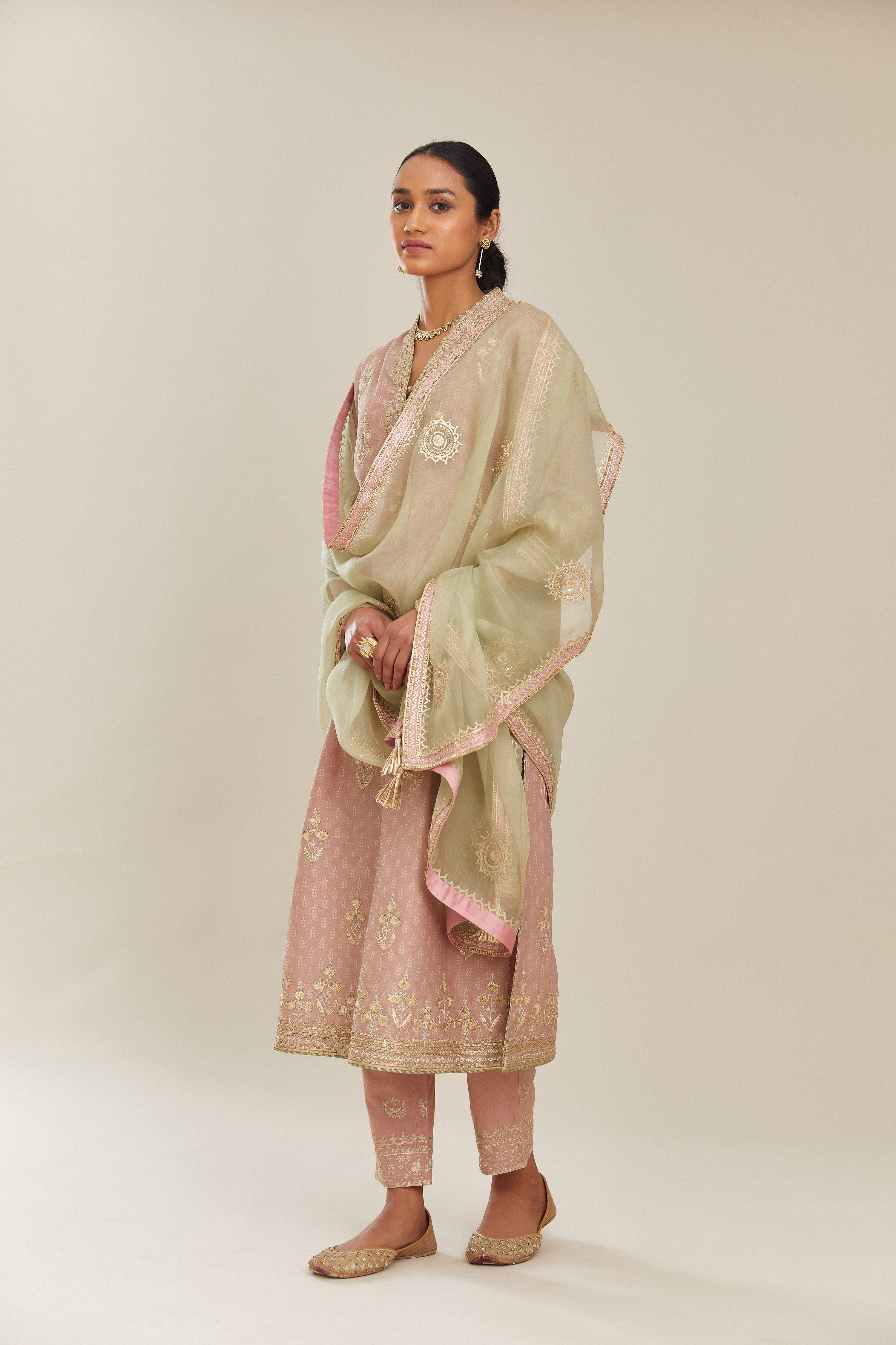 Old rose hand block printed silk chanderi kurta set with gold gota and zari embroidery butas and heavy borders at hem.