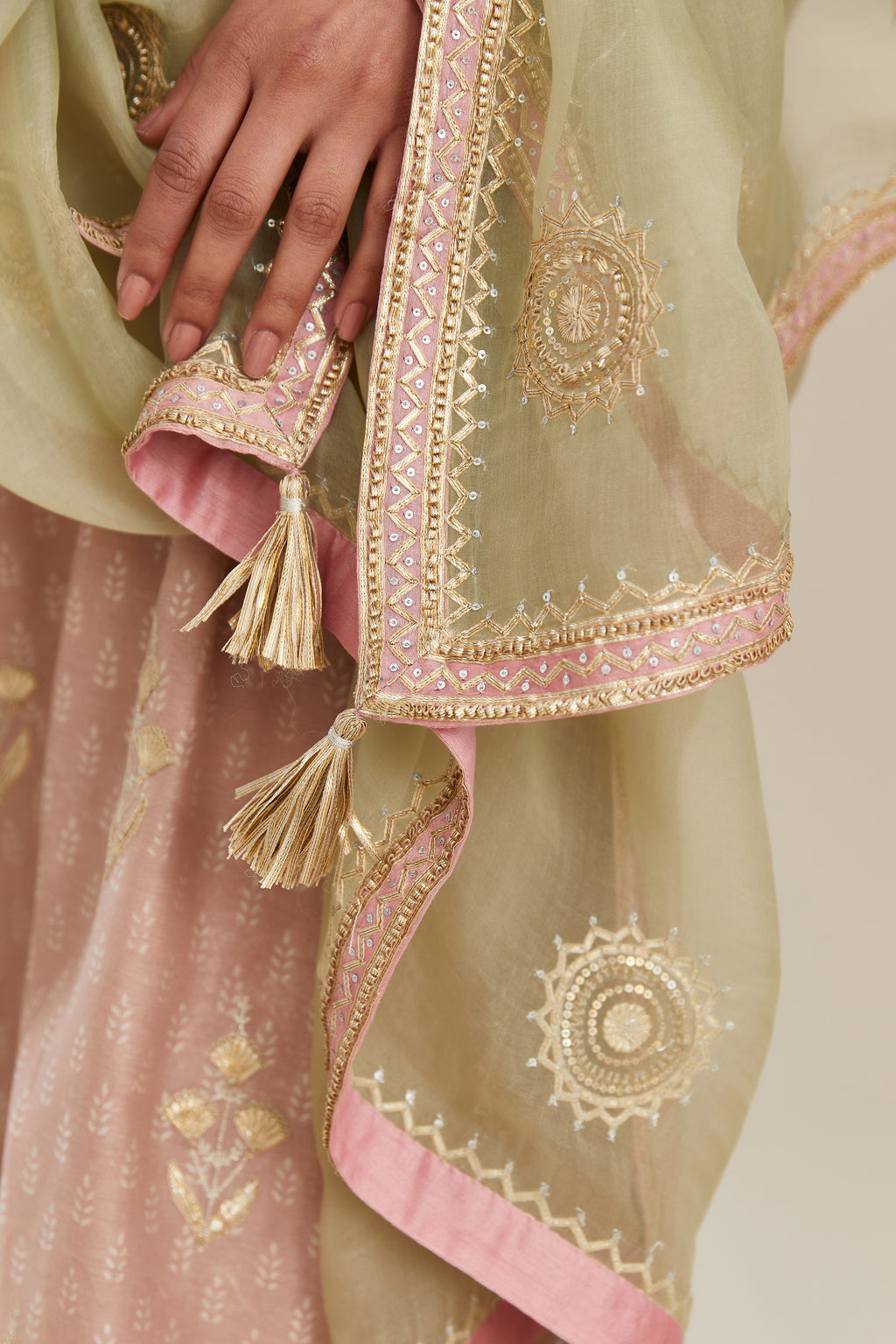 Old rose hand block printed silk chanderi kurta set with gold gota and zari embroidery butas and heavy borders at hem.