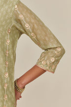 Sage green hand block printed silk chanderi straight kurta set with all over gold gota and zari embroidery.