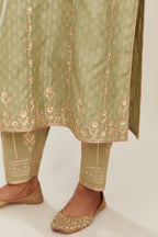 Sage green hand block printed silk chanderi straight kurta set with all over gold gota and zari embroidery.