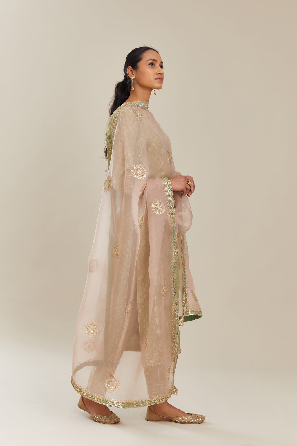 Sage green hand block printed silk chanderi straight kurta set with all over gold gota and zari embroidery.