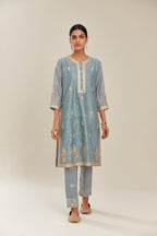 Powder blue hand block printed silk chanderi short kurta set, highlighted with gold gota and zari embroidery.
