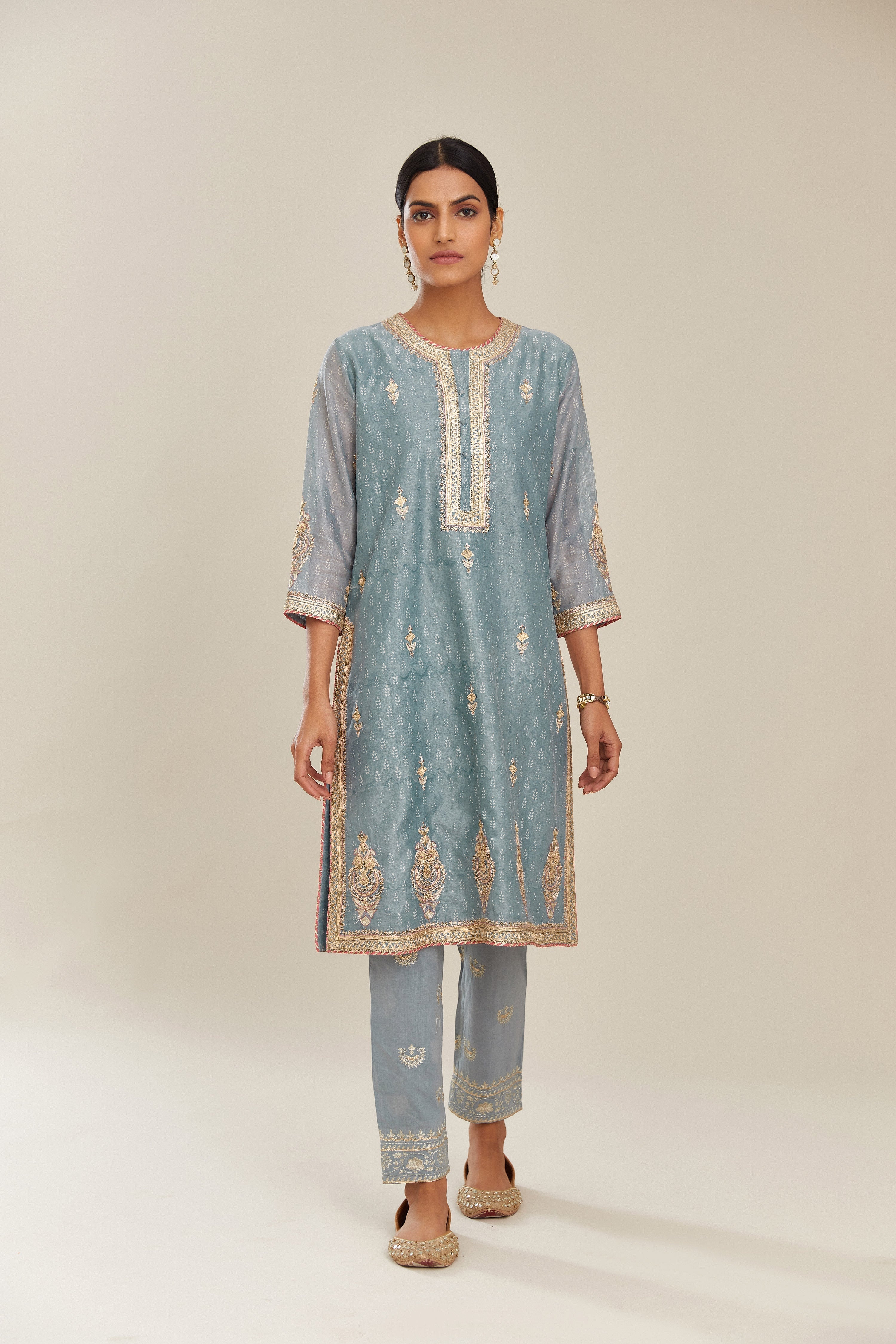 Powder blue hand block printed silk chanderi short kurta set, highlighted with gold gota and zari embroidery.