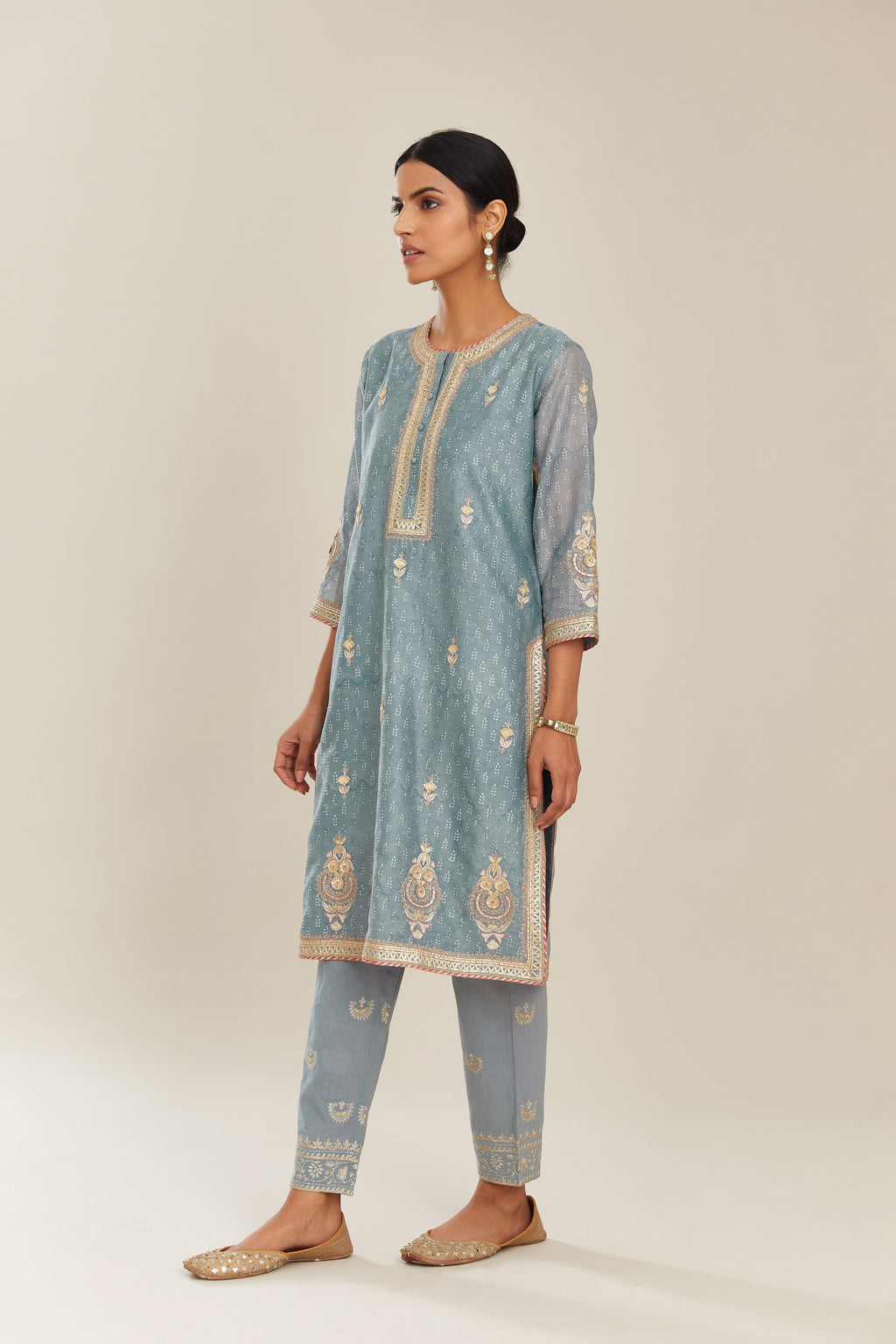 Powder blue hand block printed silk chanderi short kurta set, highlighted with gold gota and zari embroidery.